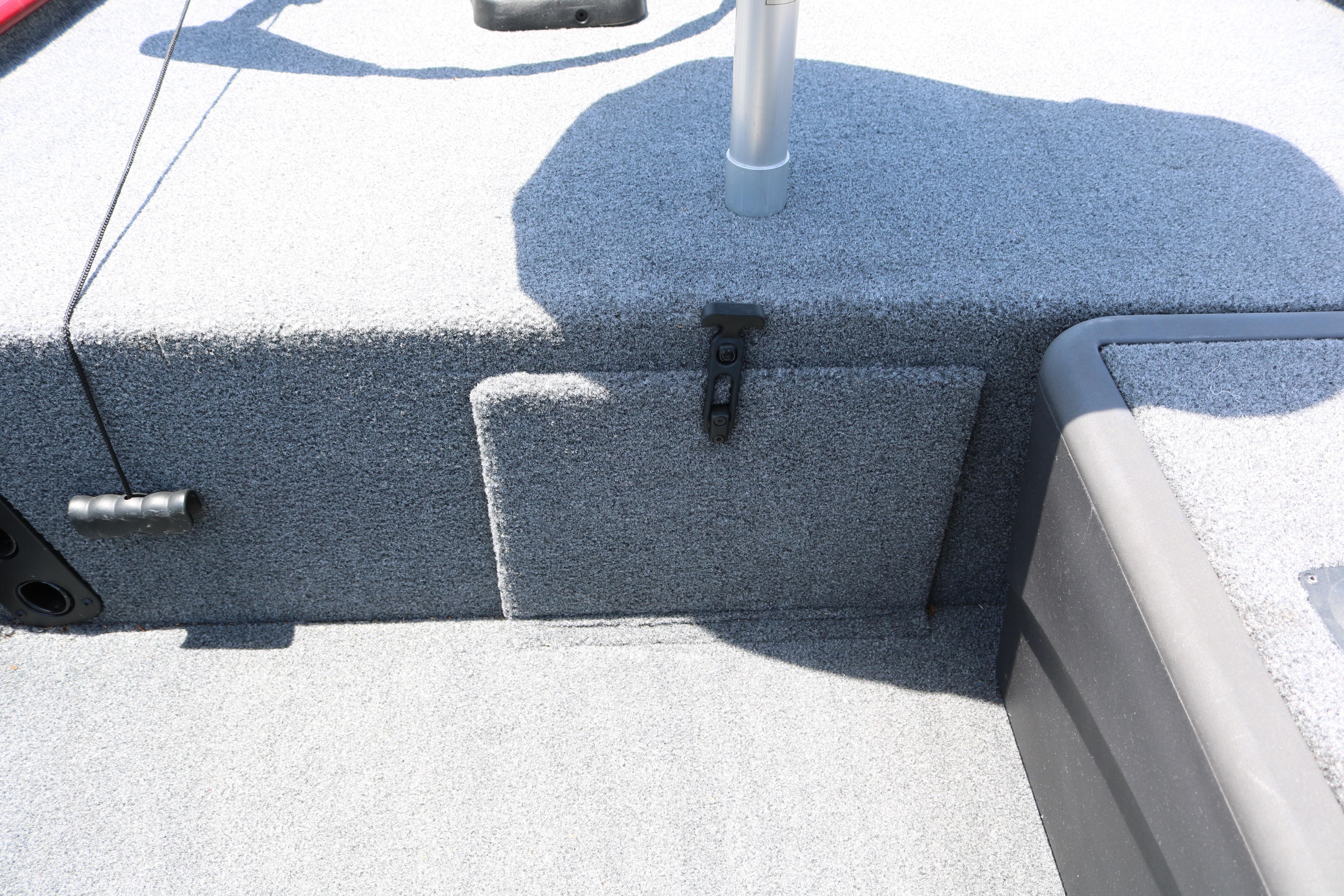 2021 Tracker Bass Tracker Classic XL boat interior with carpeted storage compartment.