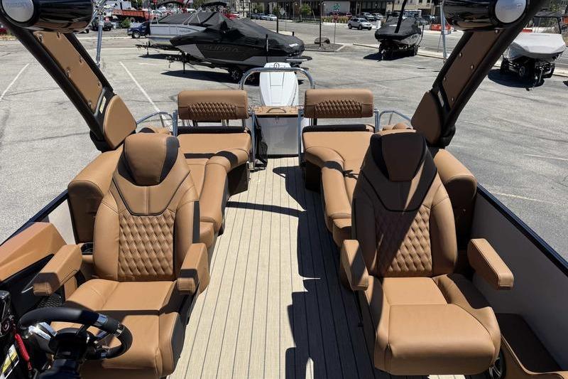 Luxurious 2026 Avalon Excalibur LTD Quad Lounge boat with plush seating and modern design.