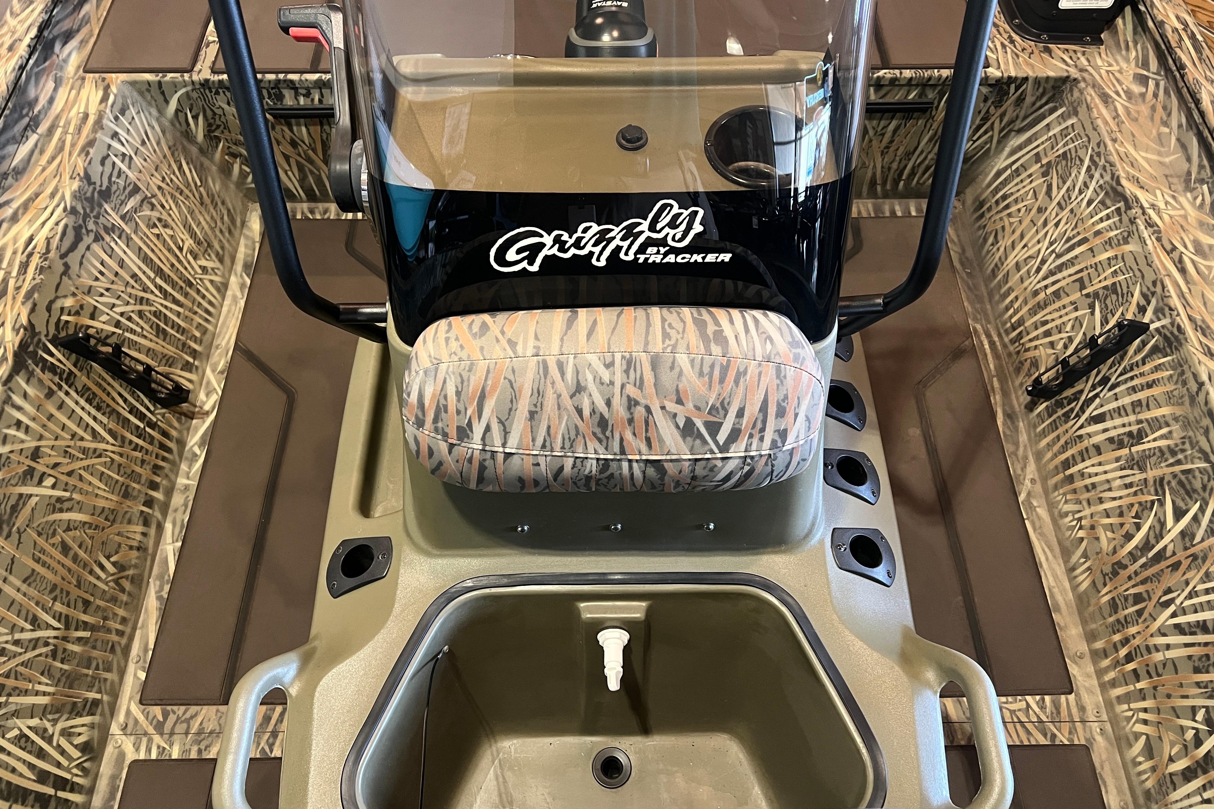 2026 Tracker Grizzly 1860 CC boat interior with camo design and central console.
