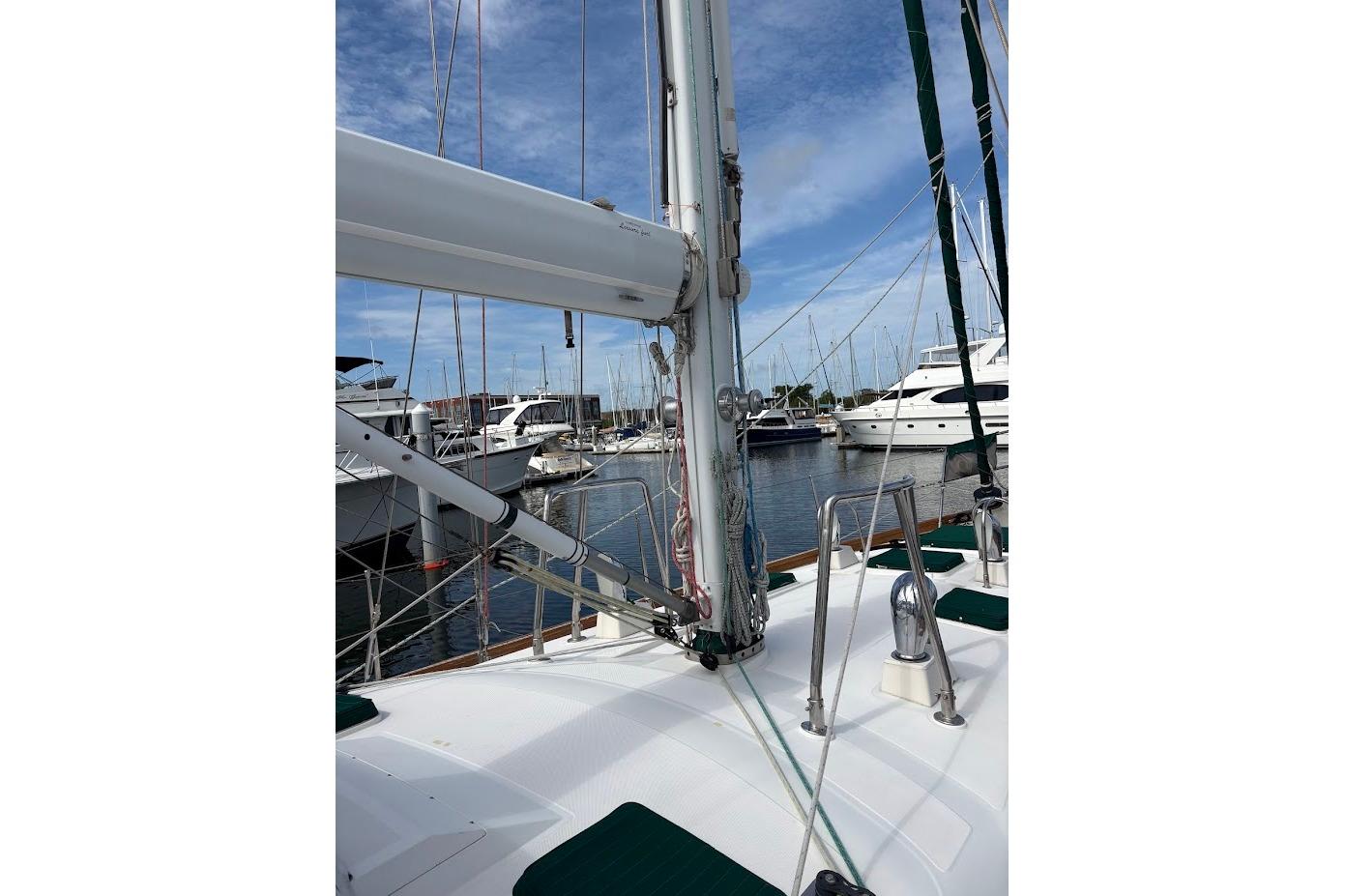 Deck view of a 1997 Taswell 50 sailboat docked in a marina.