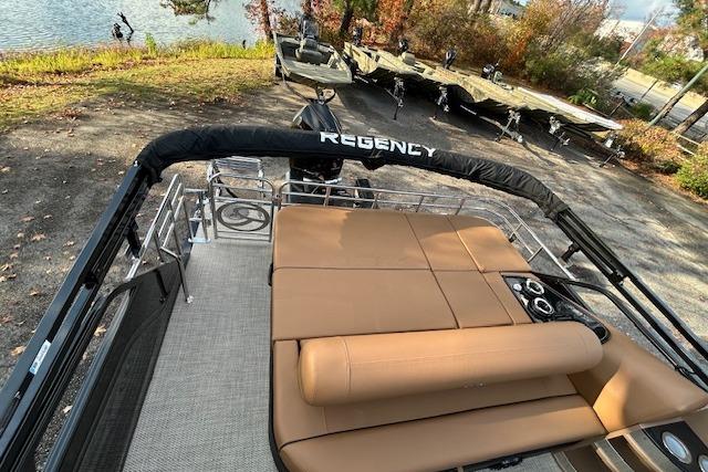 2025 Regency 230 LE3 Sport pontoon boat with spacious seating and sleek design.