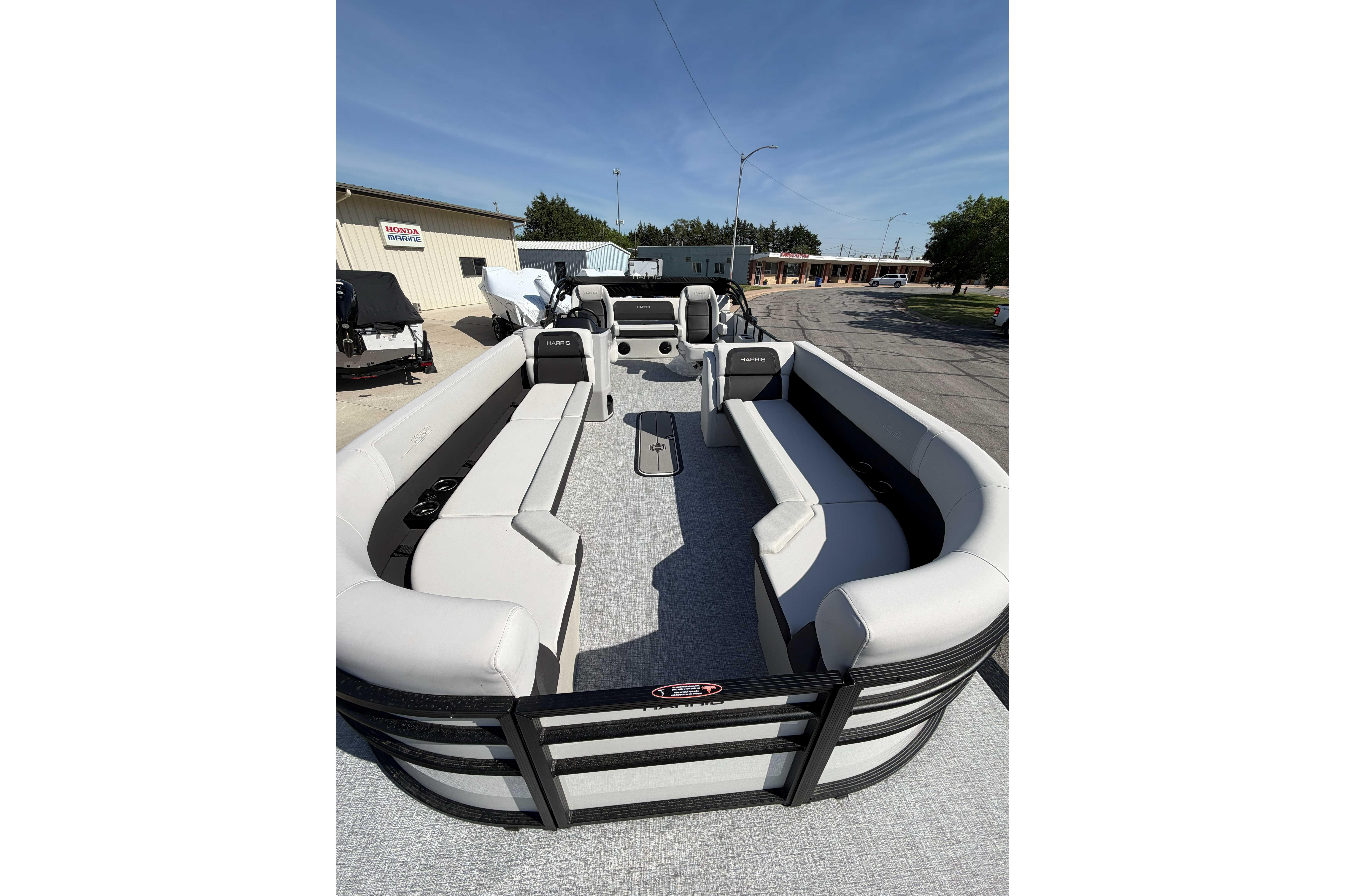 2025 Harris Cruiser 250 pontoon boat with spacious seating and modern design.
