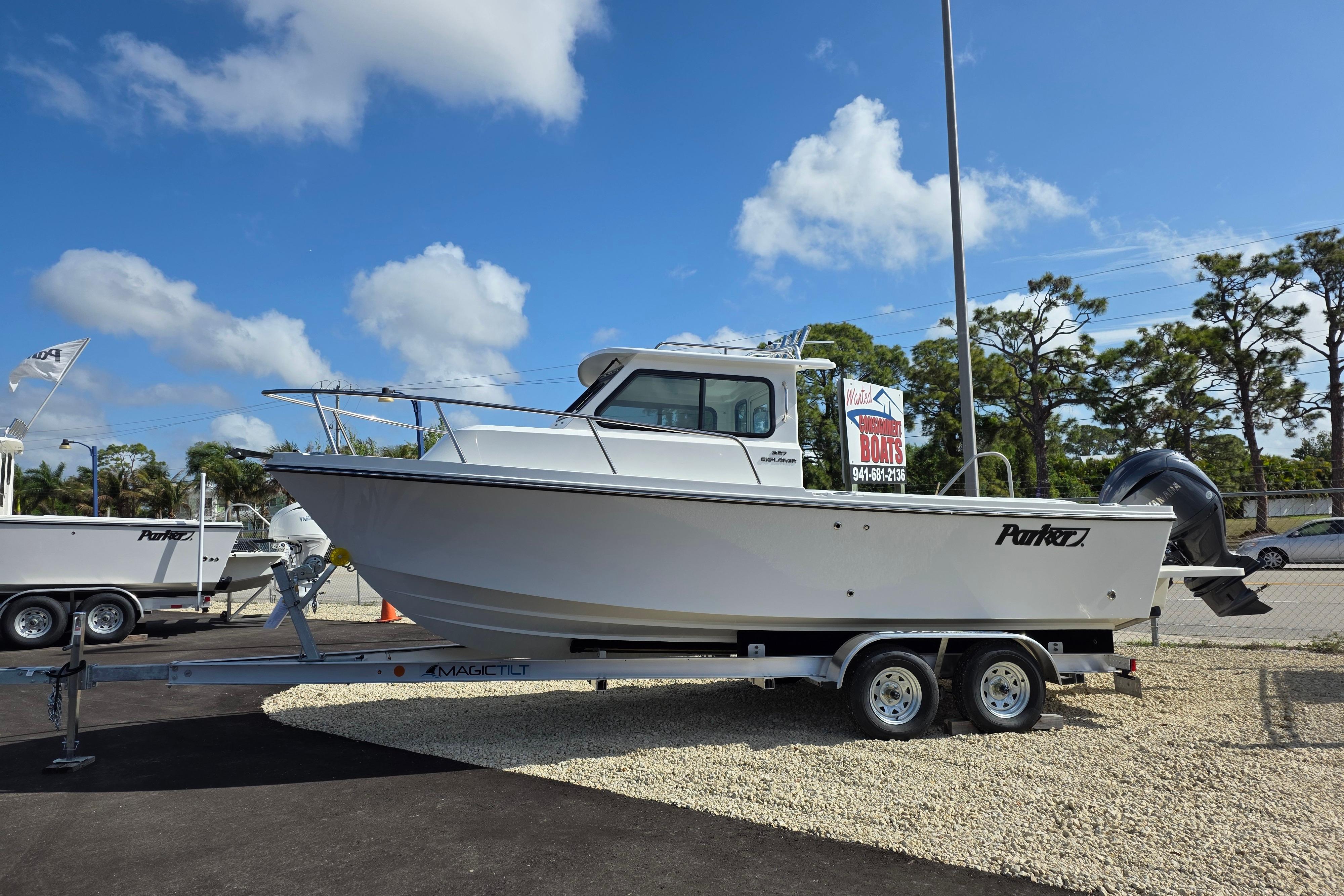 2026 Parker 227 Explorer boat on trailer under clear blue sky.