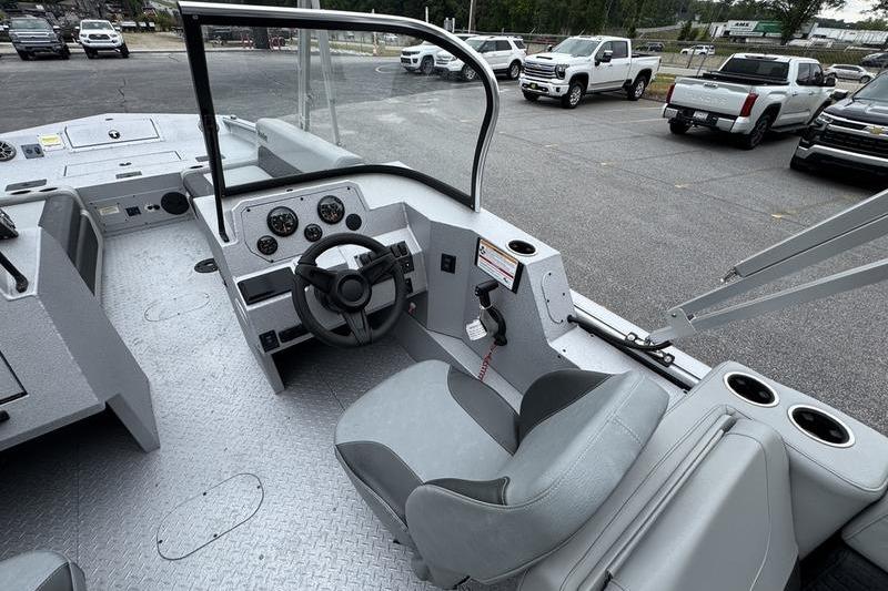 2025 SeaArk Super Lounge Easy boat interior with steering wheel and dashboard controls.