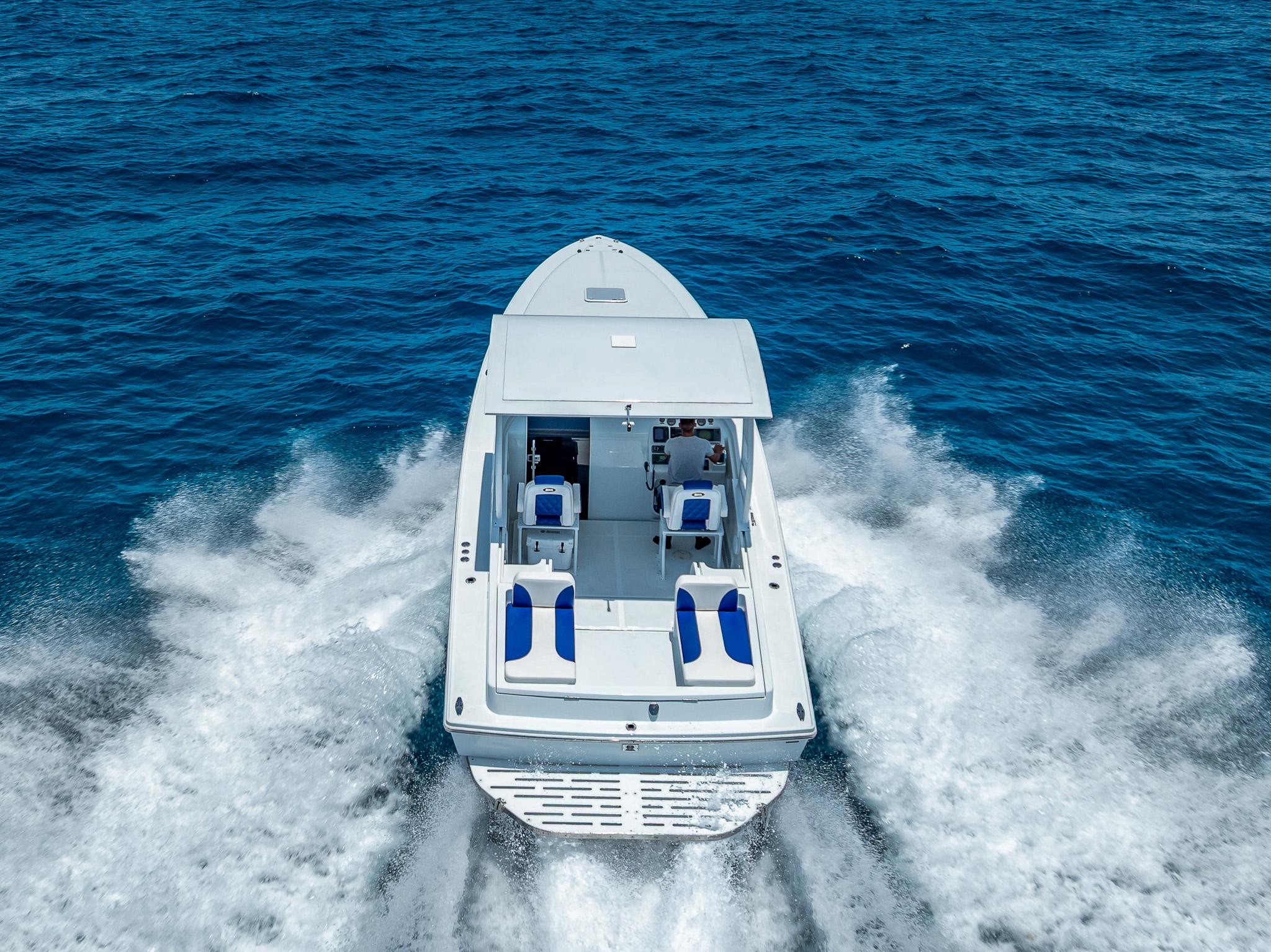 Nova 39 Sport 2020 boat cruising on open blue sea, aerial view.