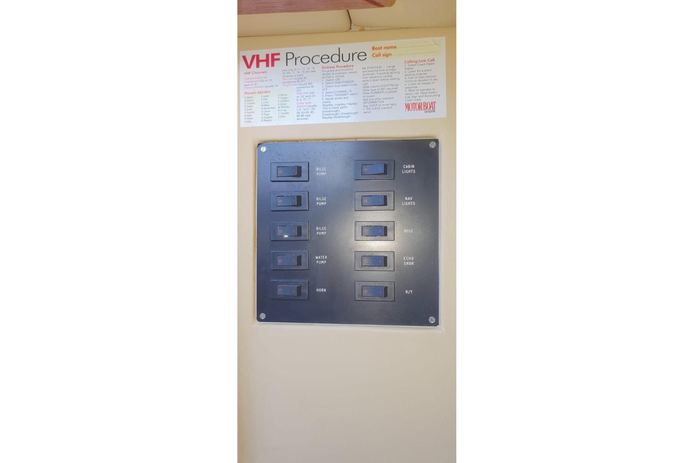 Control panel with switches and VHF procedure guide on Fairey Spearfish MKIII, 1989.