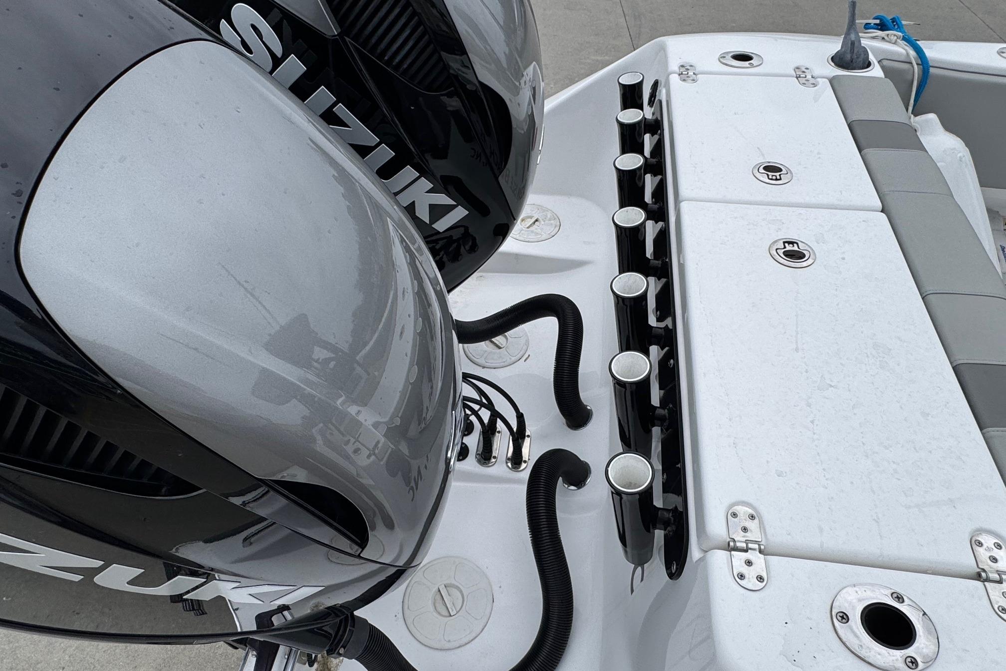 2024 Cape Horn 32 XS boat with dual Suzuki engines and rod holders.