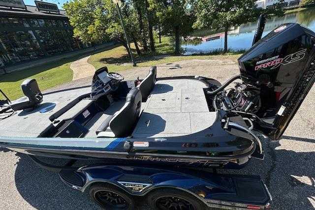 2026 Nitro Z18 Pro boat with Mercury Pro XS engine, parked near a lake.