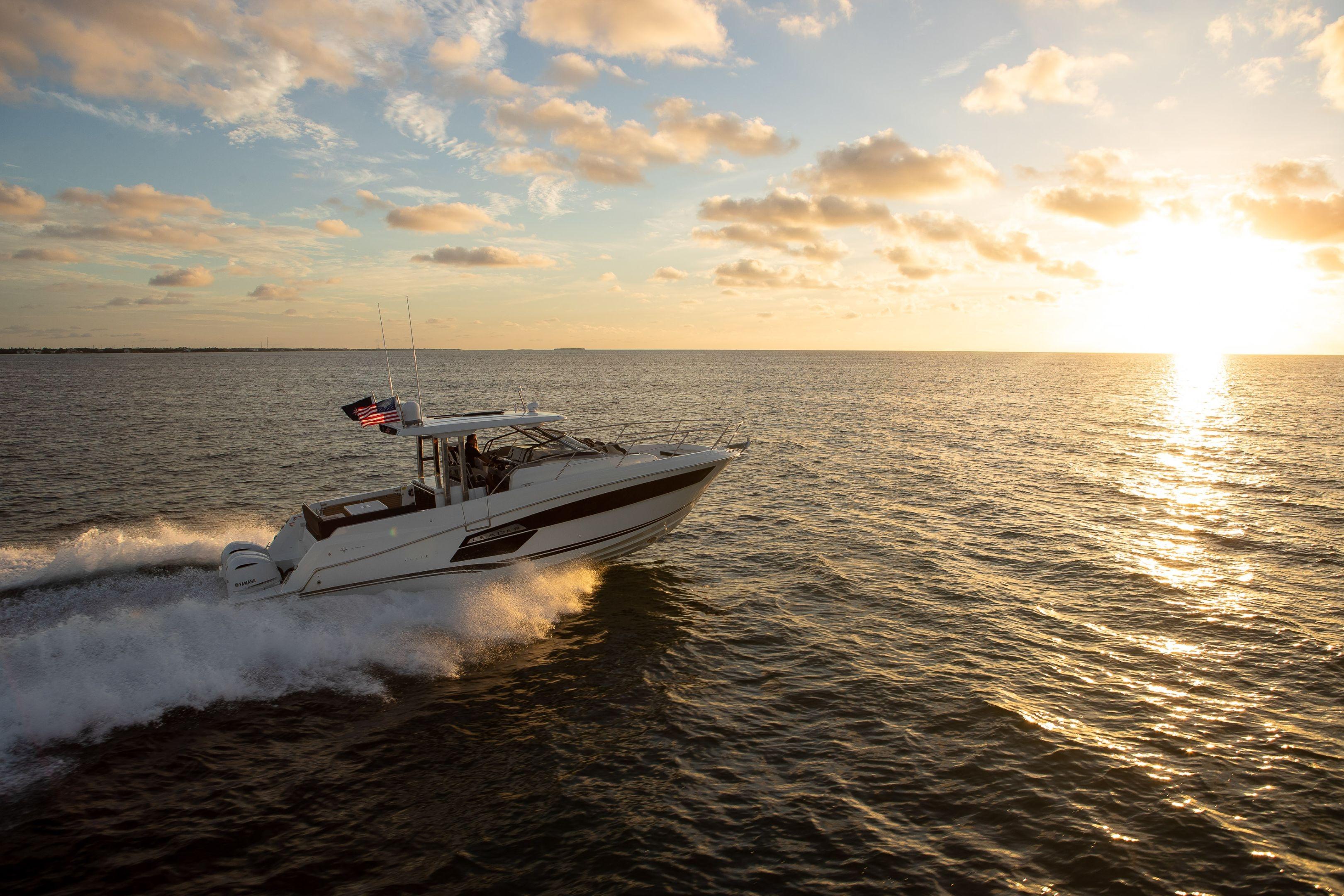 2026 Jeanneau Leader 12.5 WA cruising at sunset on open water.