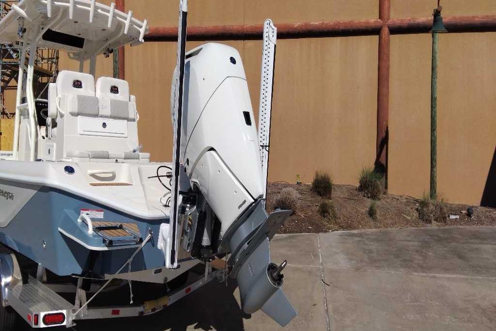 2026 Ranger 2600 Bay boat with powerful outboard motor, parked on a trailer.