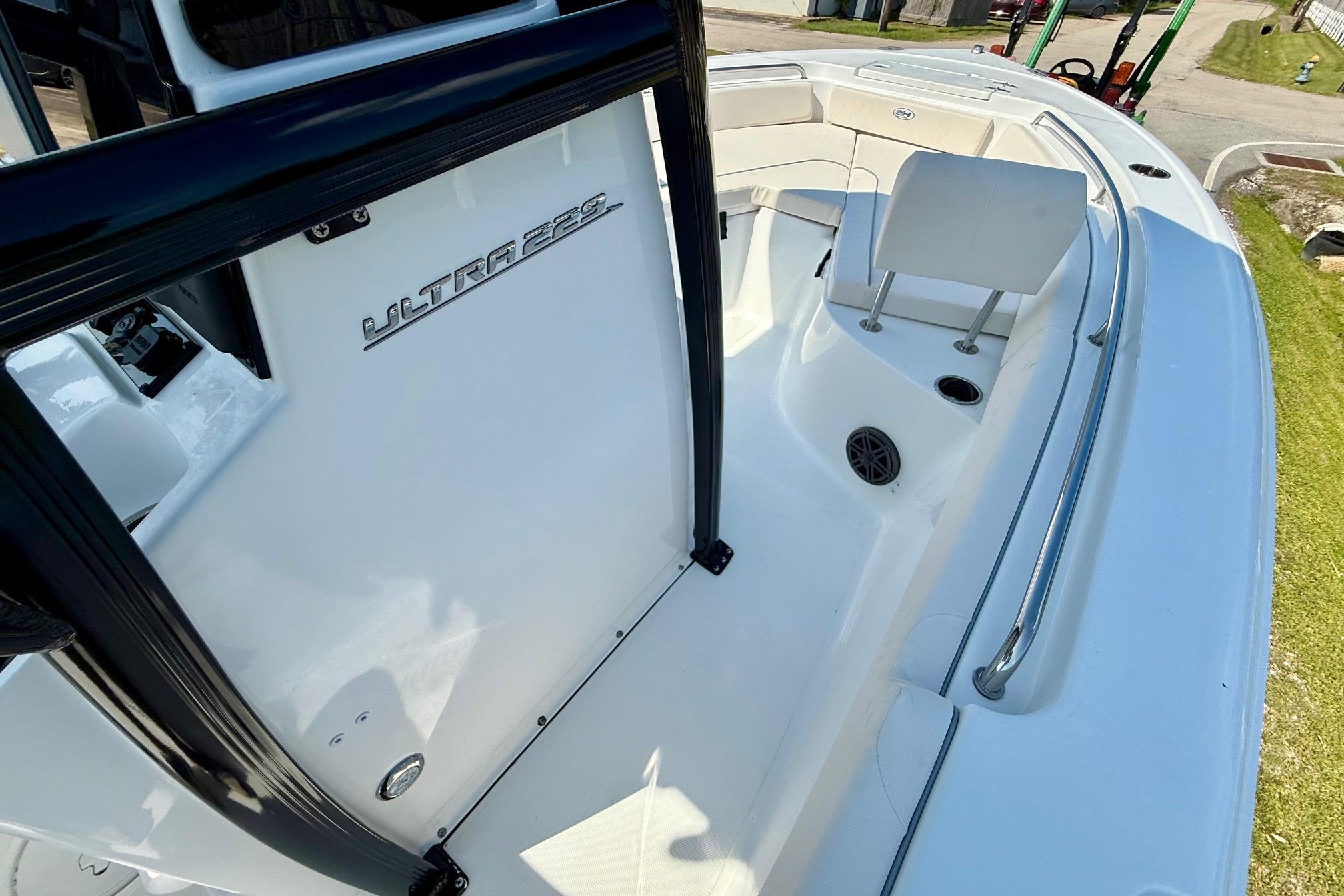 2026 Sea Hunt Ultra 229 boat interior with seating and railing.