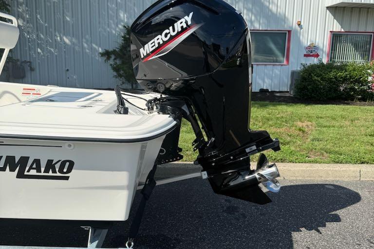 2026 Mako Pro Skiff 17 CC with Mercury outboard motor, parked outdoors.