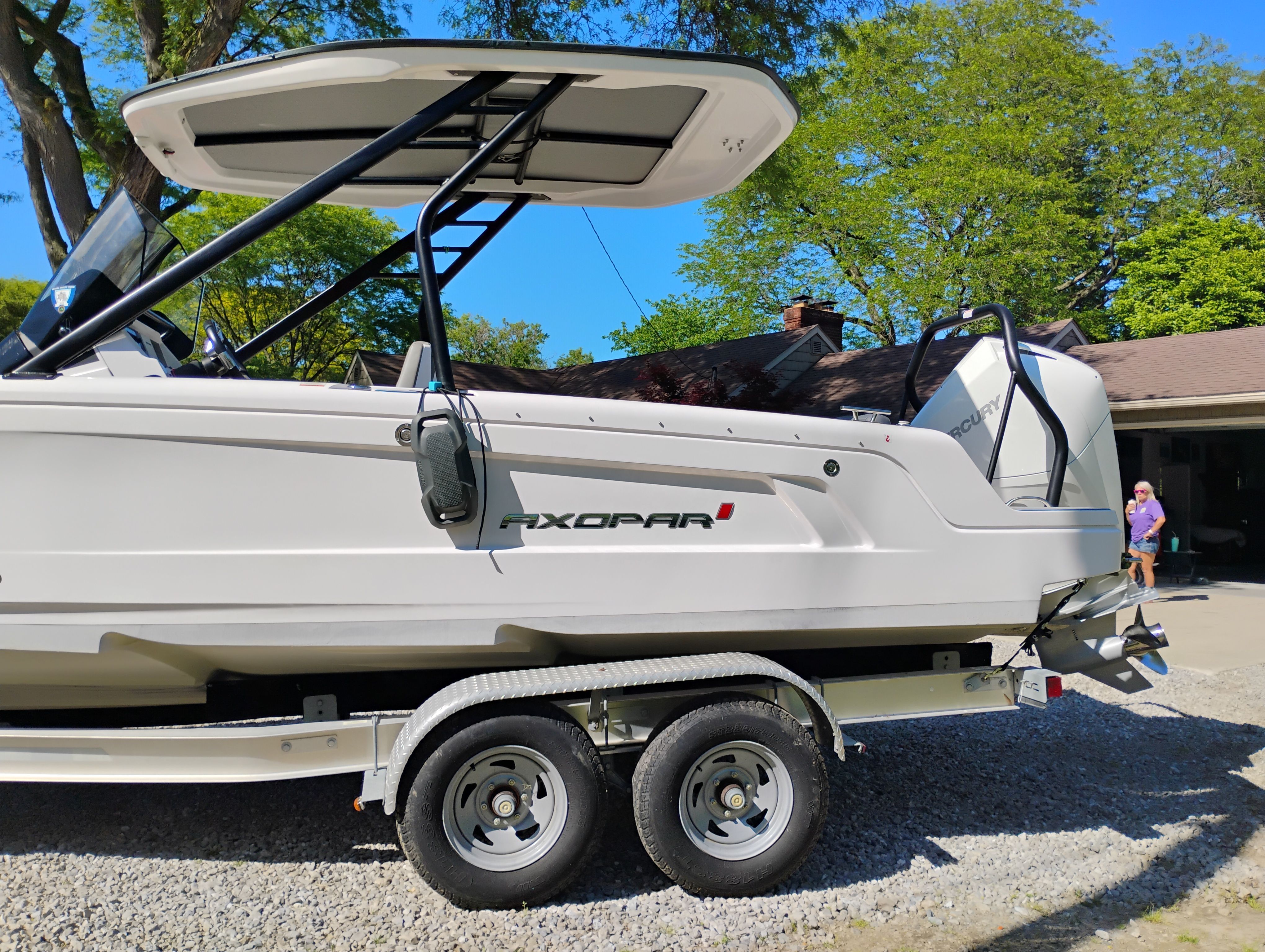 2022 Axopar 22 T-Top boat on trailer outdoors.