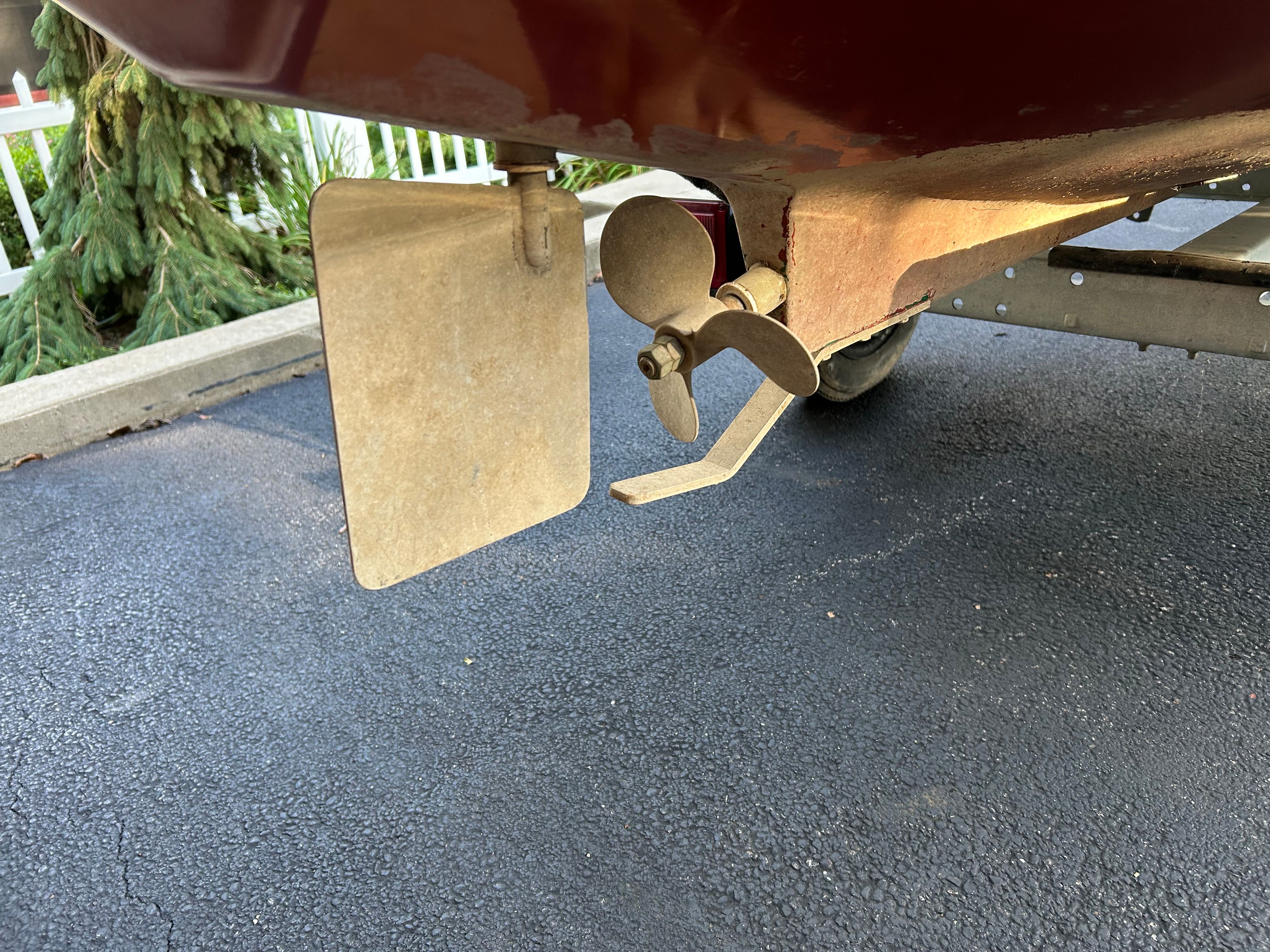 Elco Launchboat 1995 rudder and propeller on asphalt.
