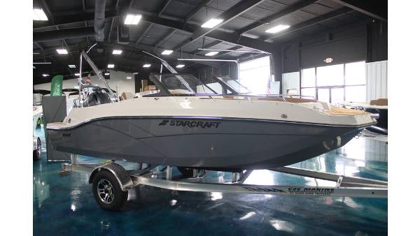 2025 Starcraft SVX 190 OB DC boat displayed indoors on a trailer.