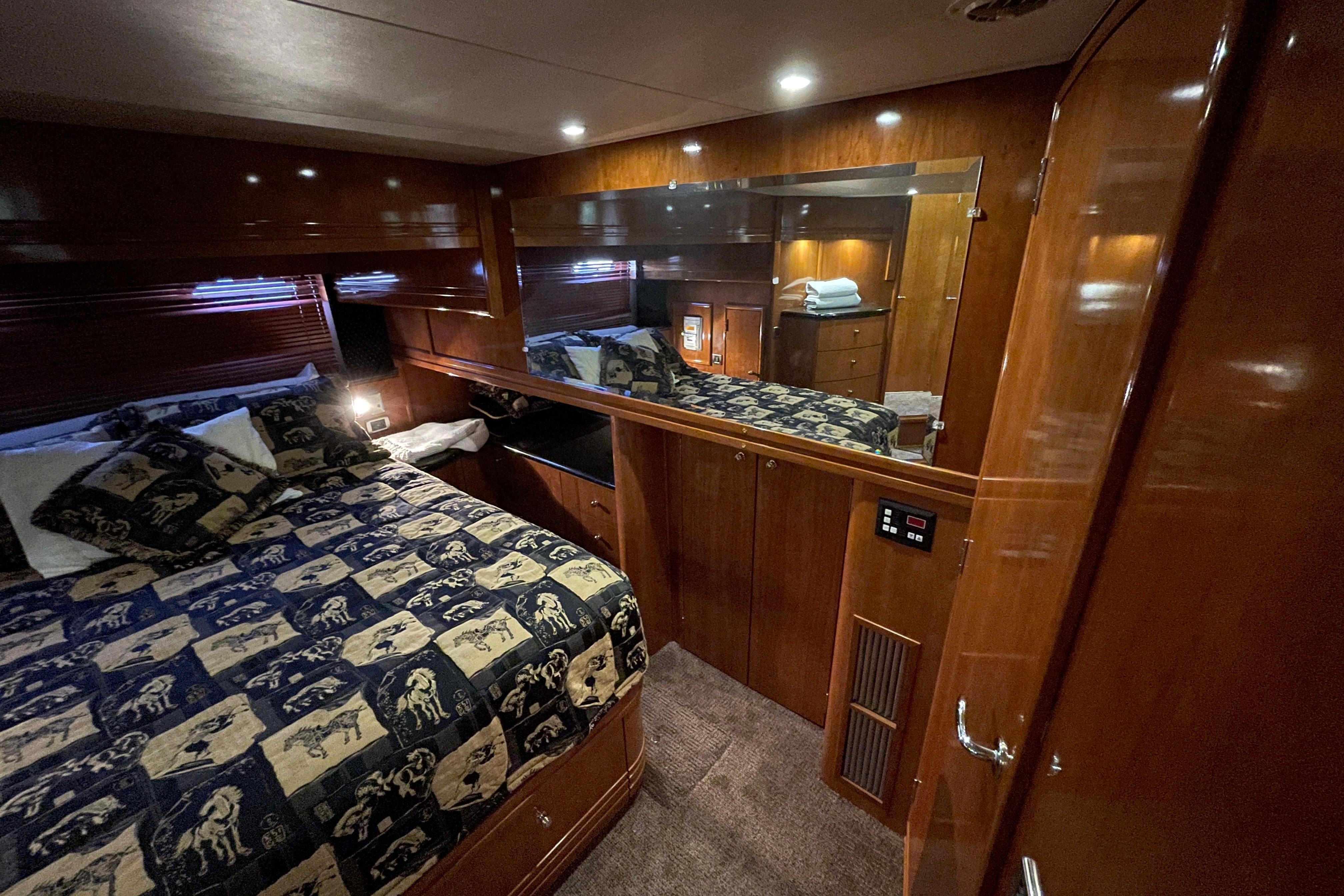 Luxurious cabin interior of 2002 Carver 570 Voyager Pilothouse with elegant wood finish.