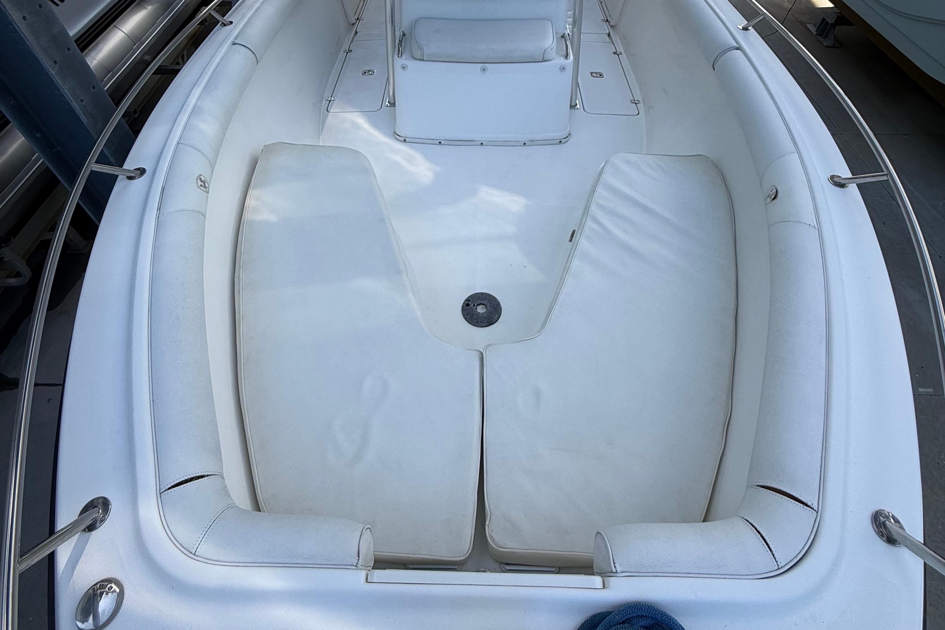 2008 Century 2901 Center Console boat interior with cushioned seating and stainless steel railings.