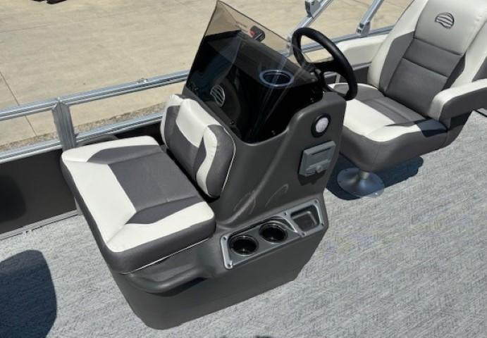 2026 Sun Tracker Bass Buggy 18 DLX boat interior with steering console and seating.