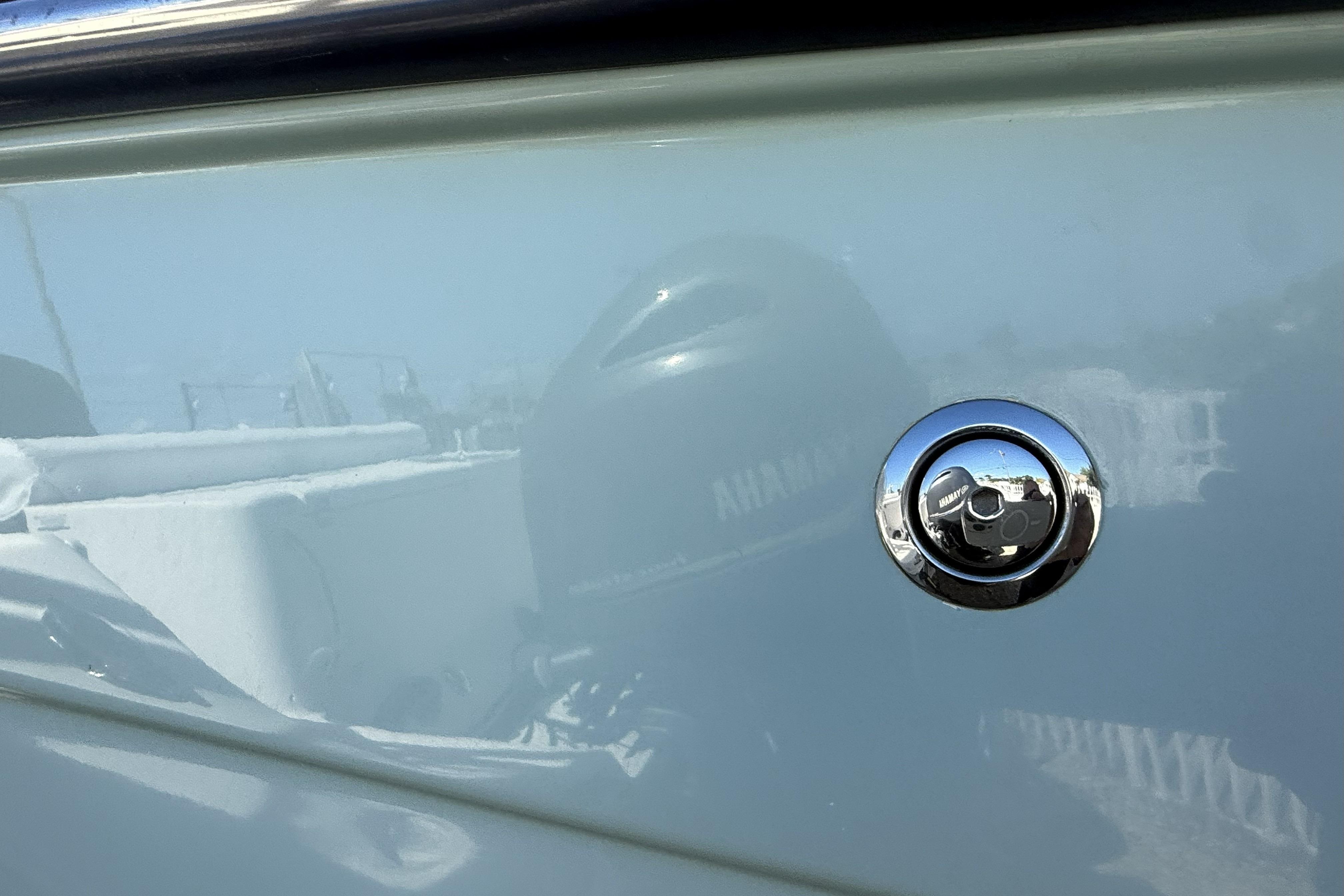 2014 Grady-White Freedom 275 boat with chrome detail and reflection.