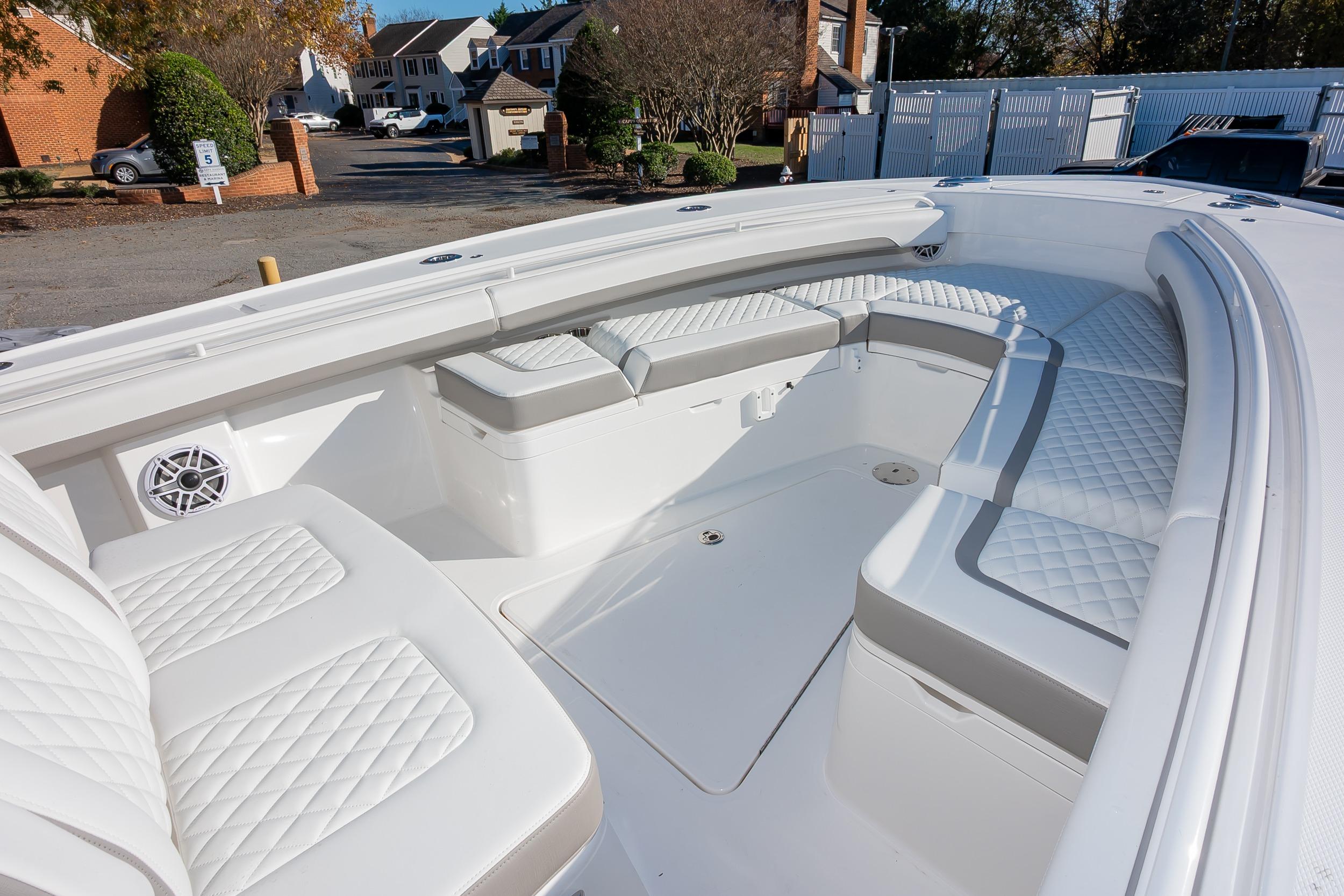 2026 Regulator 28 boat interior with white quilted seating and speaker.