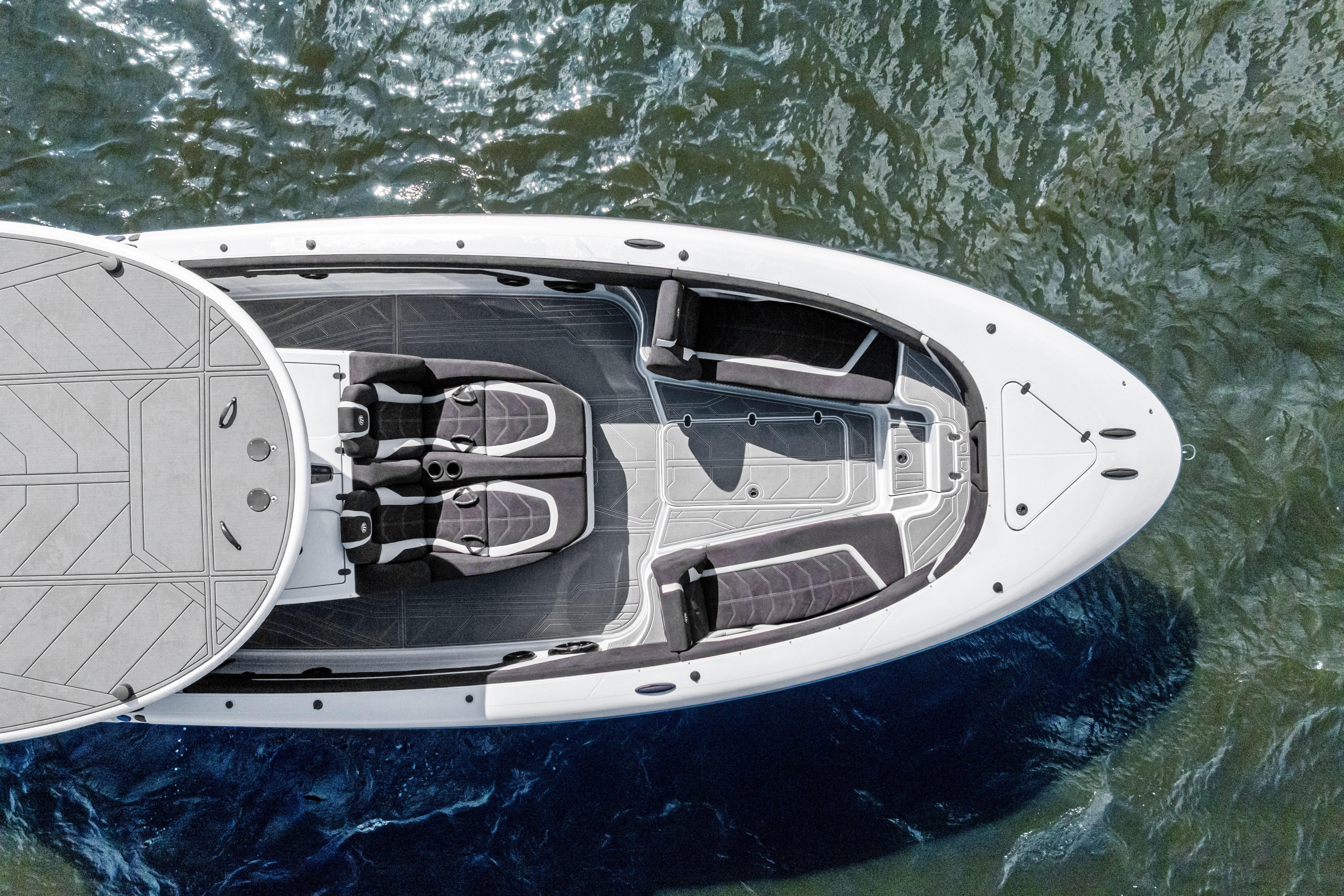 Aerial view of 2027 Mystic Powerboats M4200 on water, showcasing sleek design and seating layout.