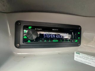 A Sony car stereo is installed in the dashboard of a boat.