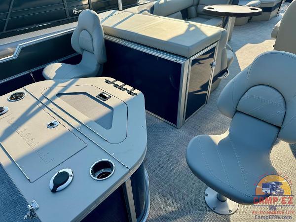 Interior of 2025 South Bay 224FCR LE pontoon boat with seating and table.