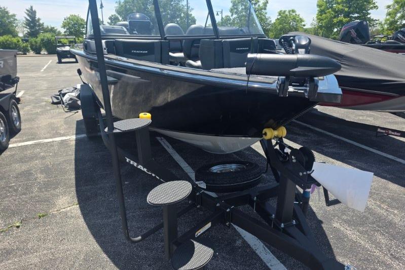 2026 Tracker Targa V-18 Combo boat on trailer in parking lot.