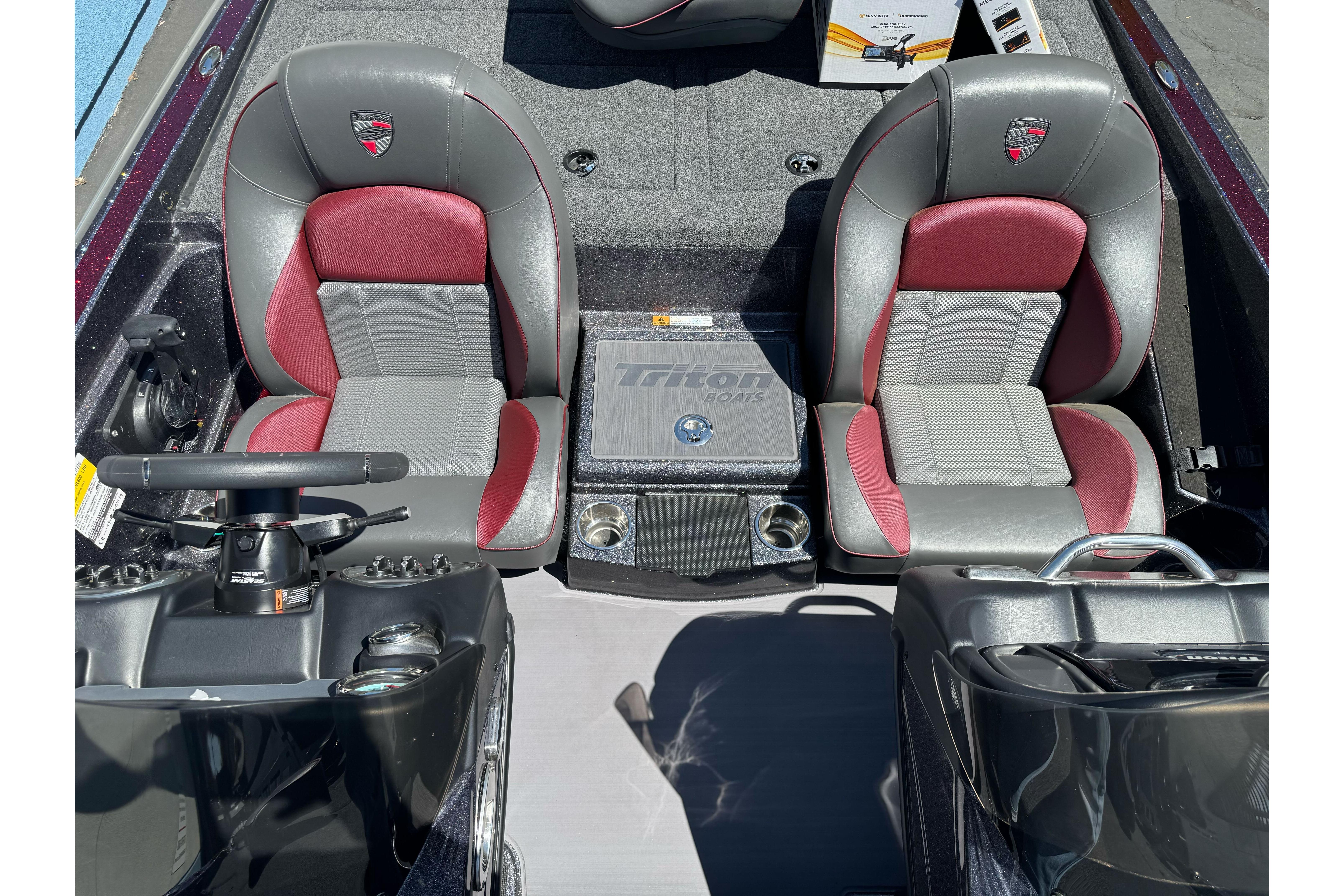 2026 Triton 18 TrX boat interior with dual seats and steering console.