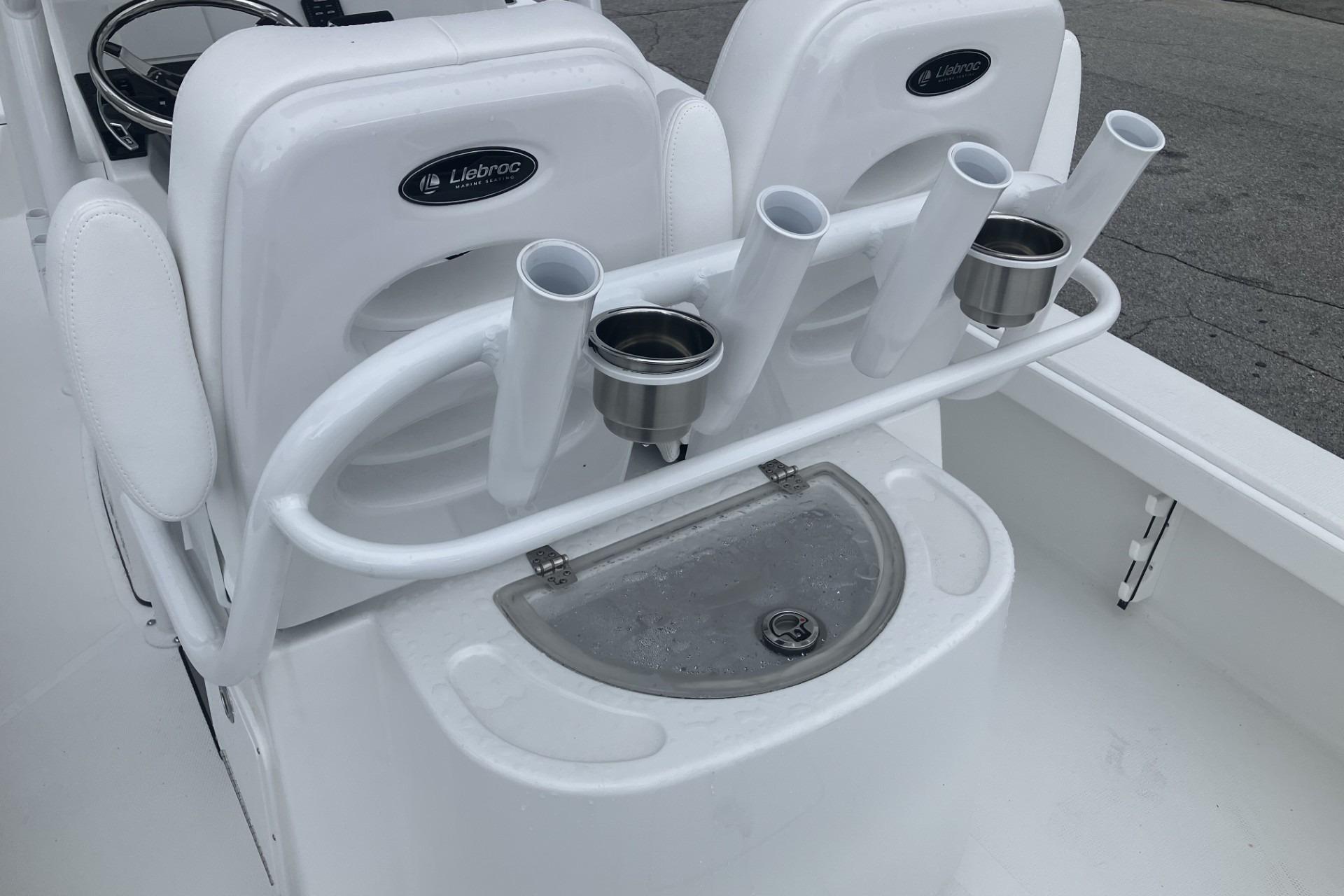 Fishing rod holders and cup holders on a 2026 BlackJack 256 Coastal boat.