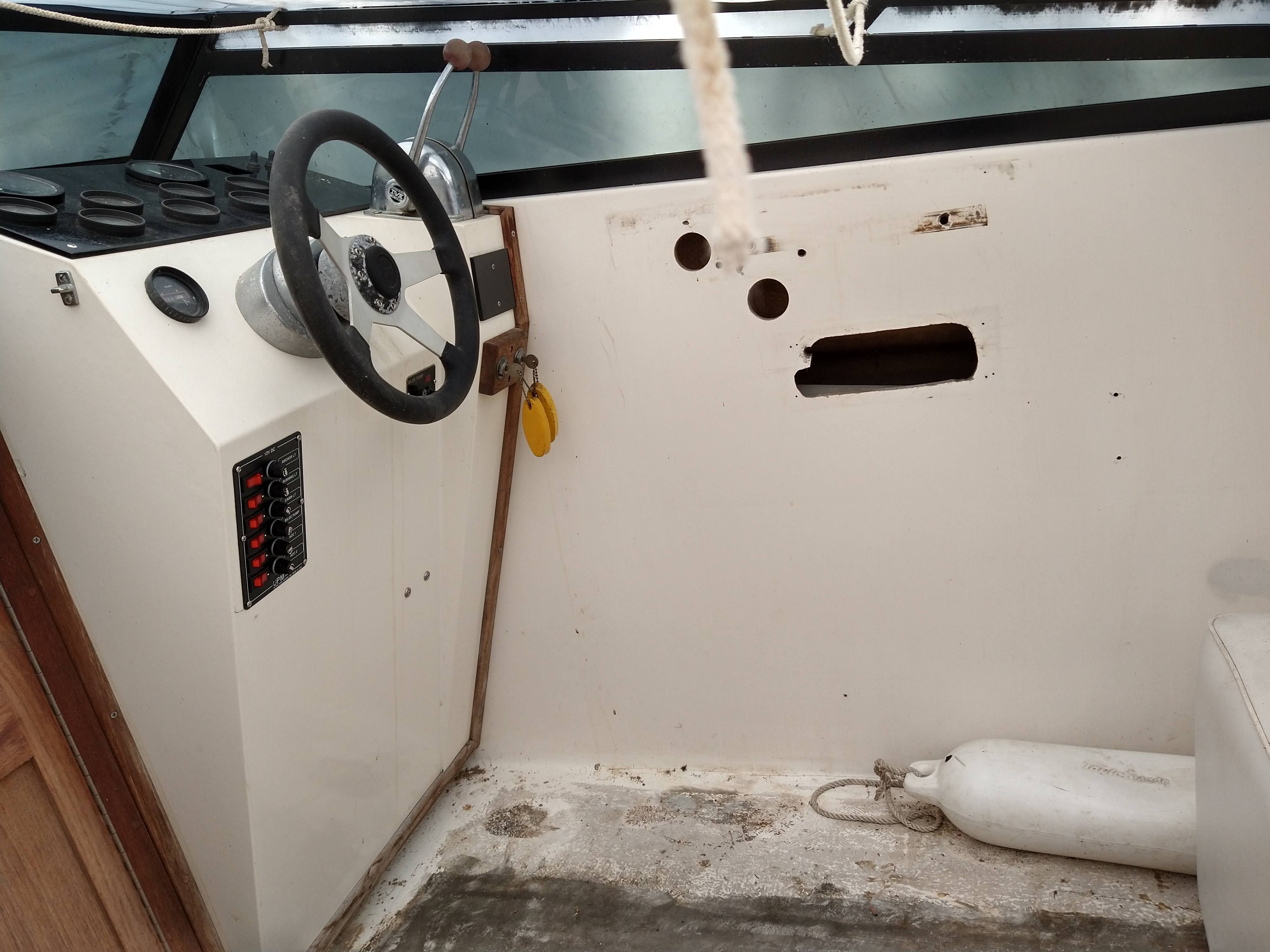 Interior of a 1986 Corsa Performance Boat with steering controls.