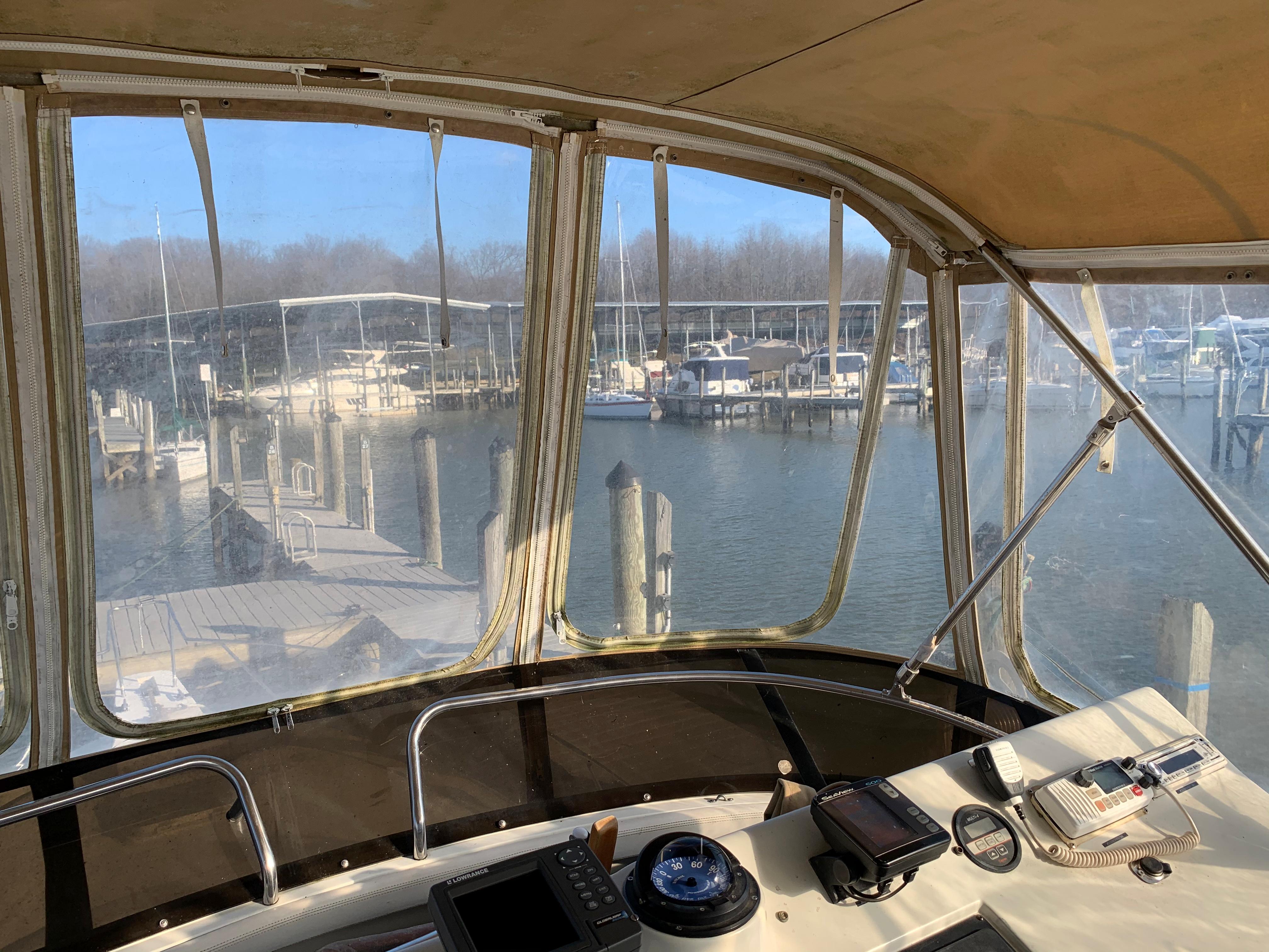 1992 Silverton 34 Aft Cabin Motor Yacht interior view at marina dock.