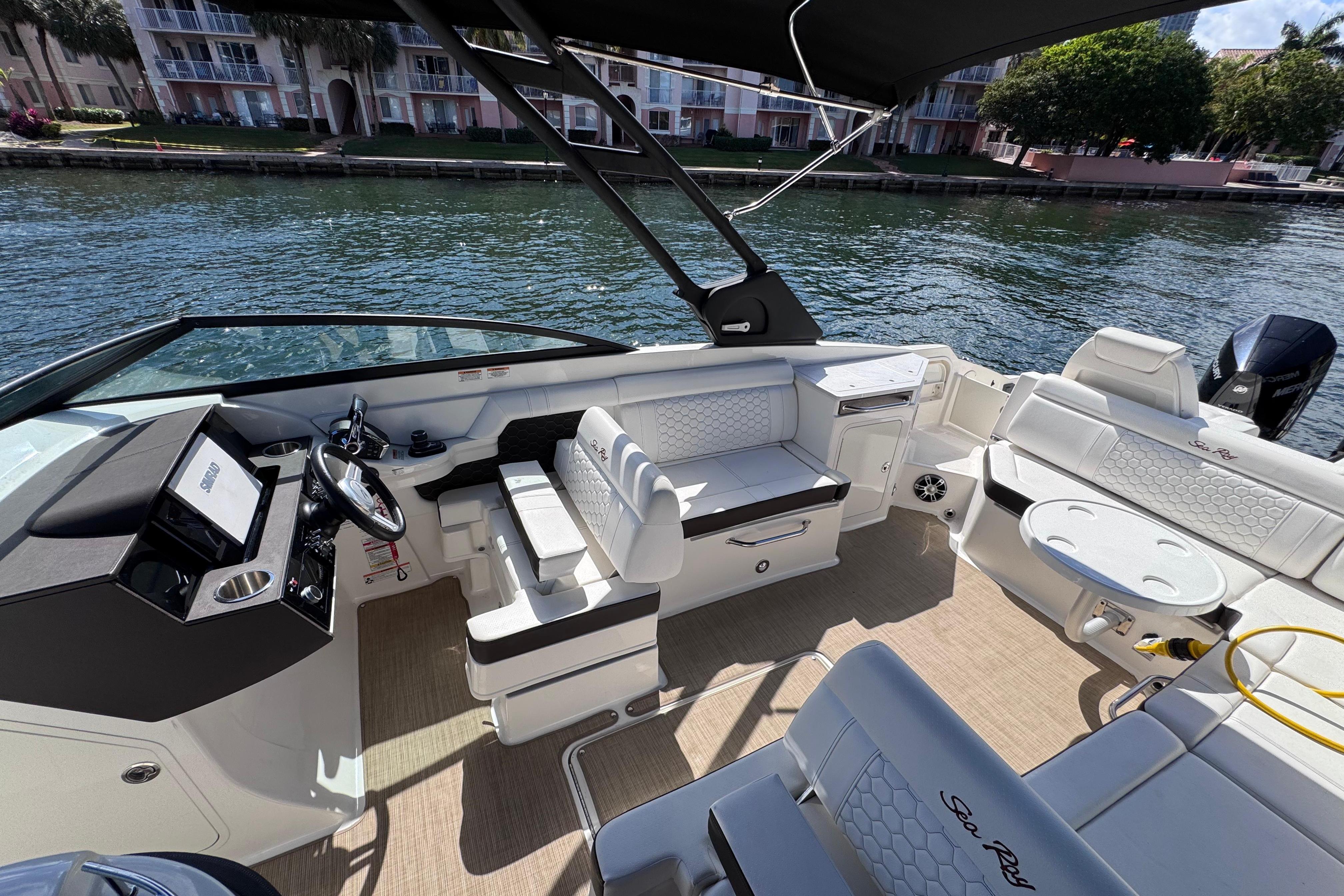 2024 Sea Ray SDX 290 Outboard boat interior with seating and steering console.