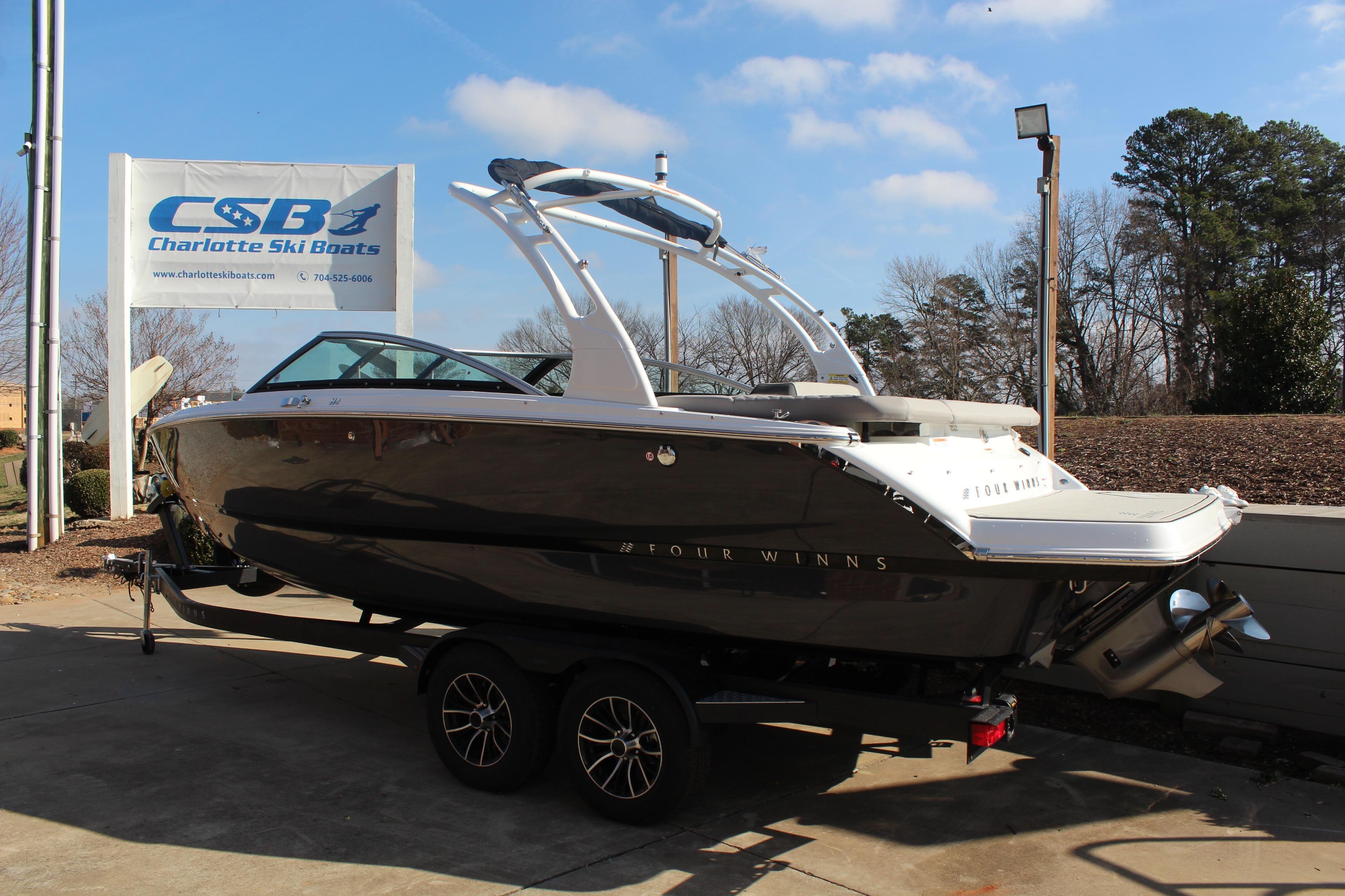 2026 Four Winns H4 boat on trailer at Charlotte Ski Boats dealership.