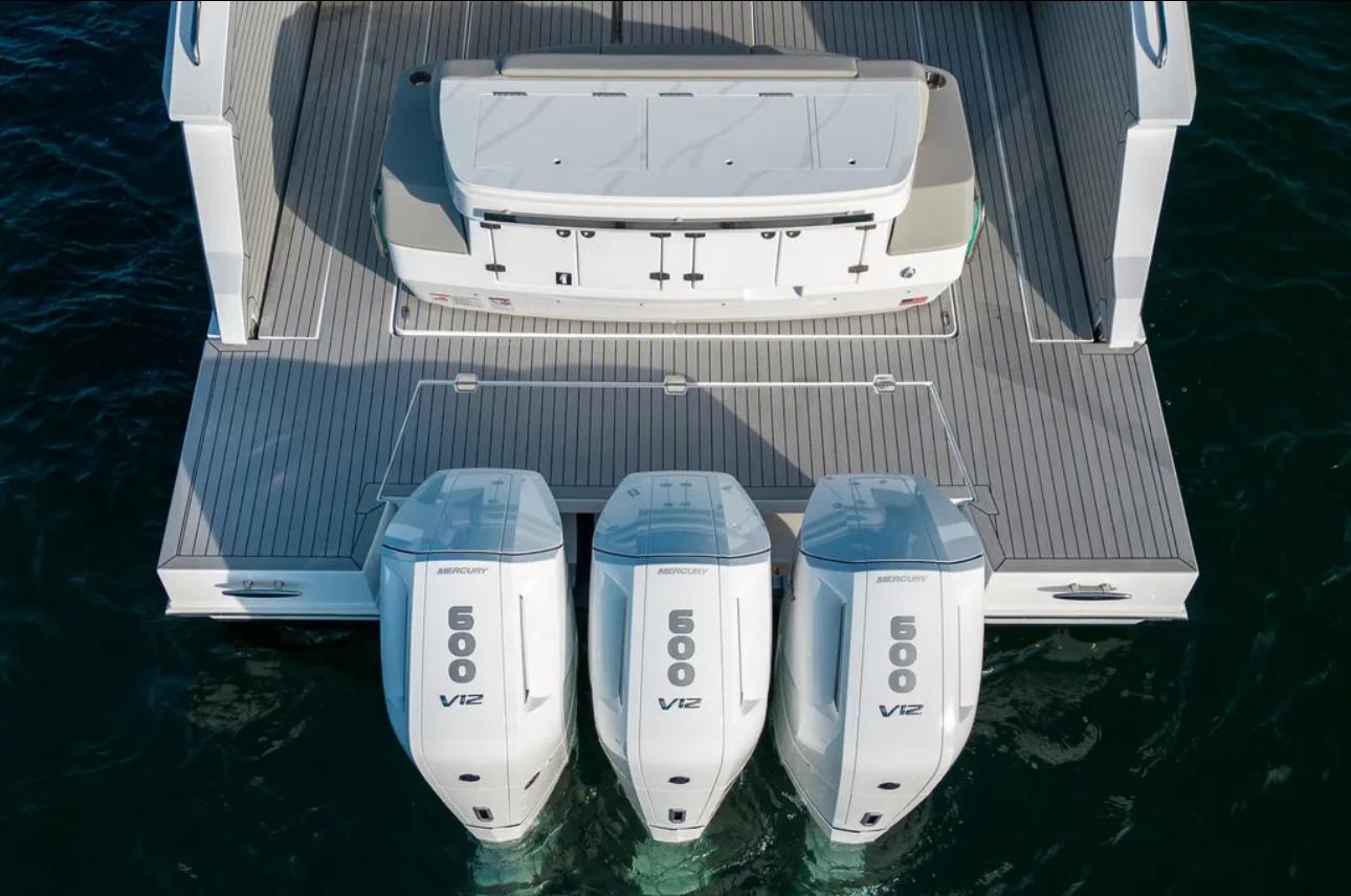 2025 Cruisers Yachts 50 GLS with triple 600 V12 engines on water.