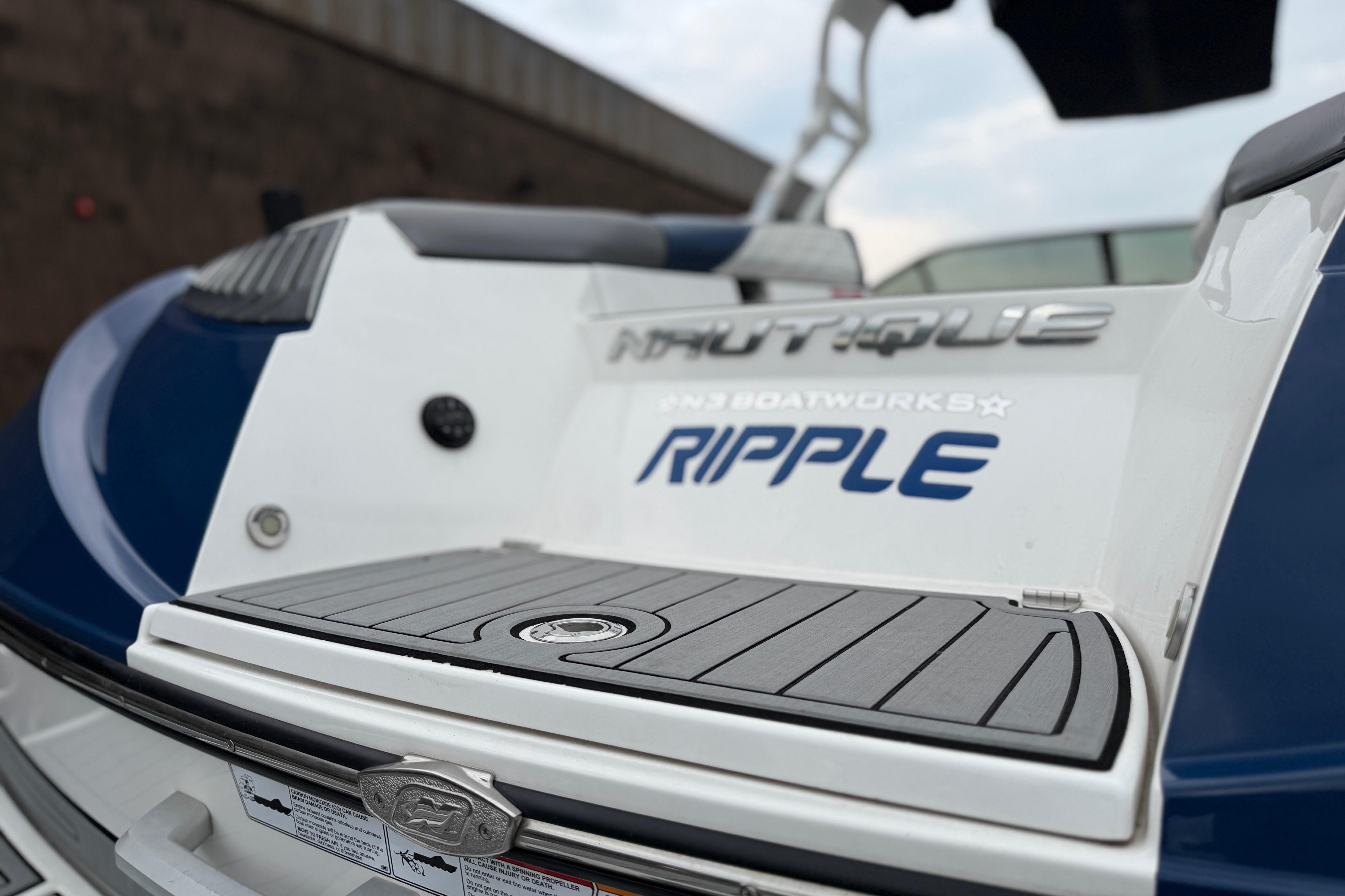2016 Naitique G25 boat rear view with "Ripple" branding and sleek design.