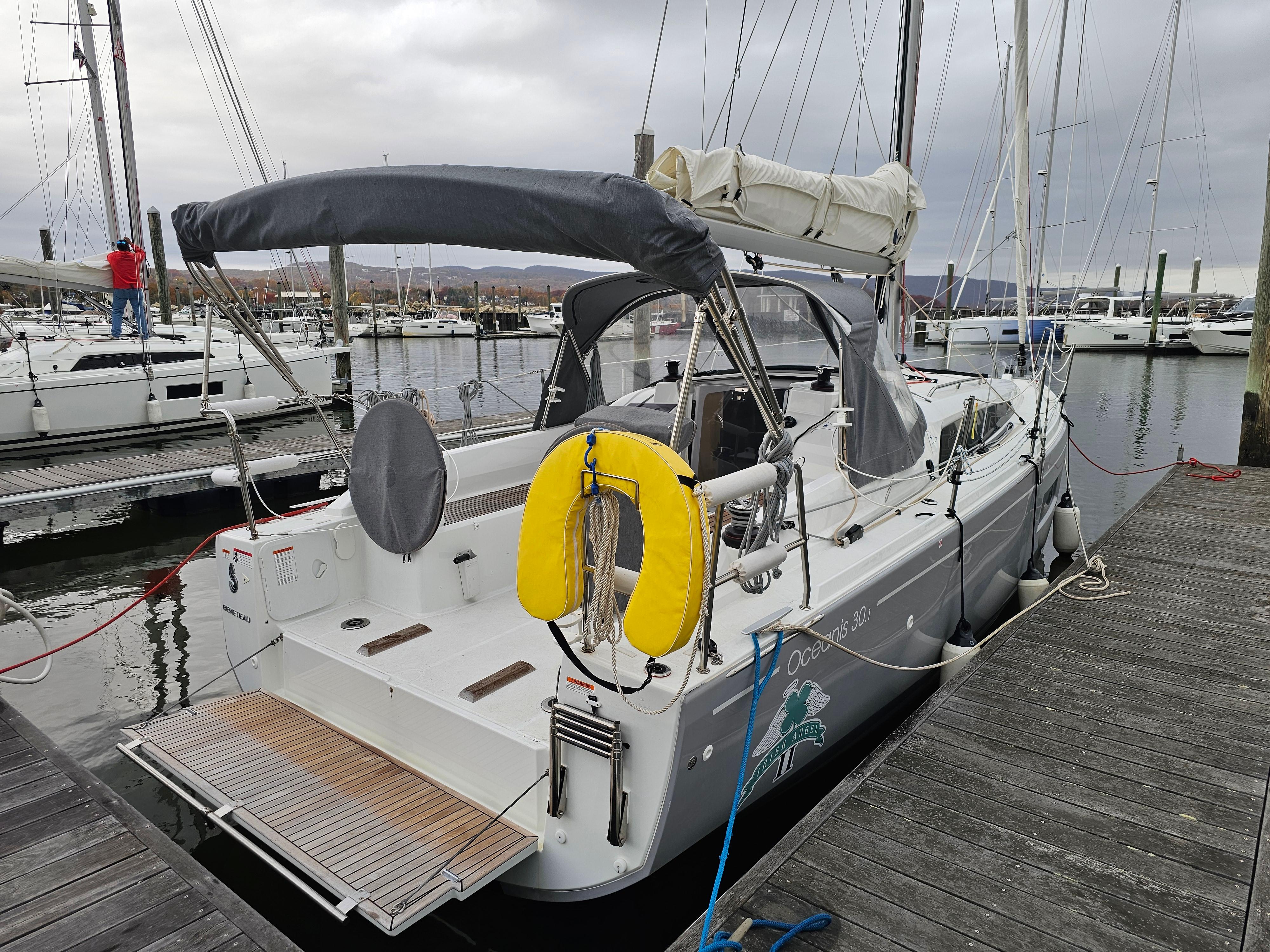 2022 Beneteau Oceanis 30.1 sailboat docked at marina, featuring a sleek design and modern amenities.