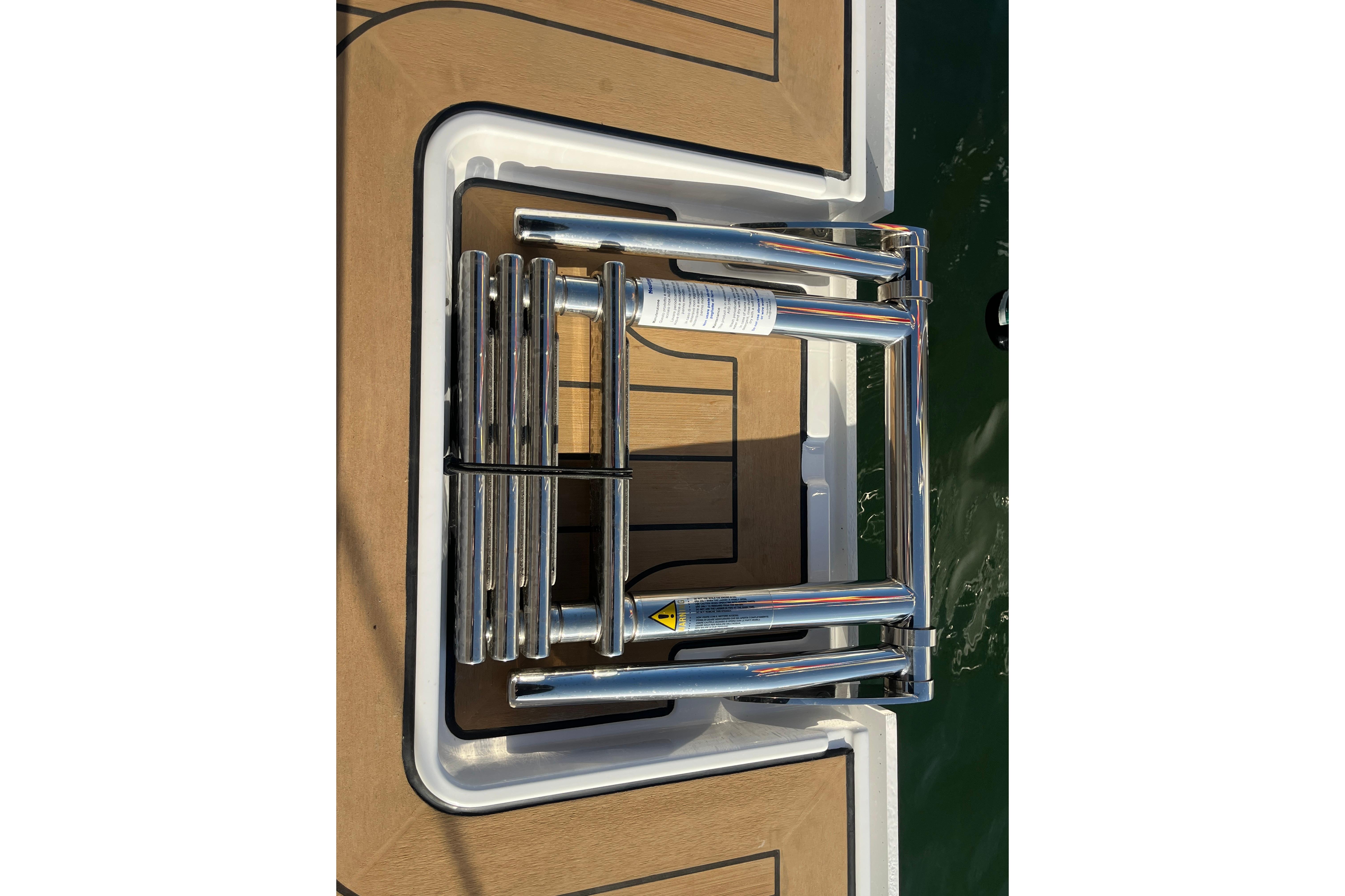 Stainless steel ladder on 2025 Hanse 360 yacht deck.
