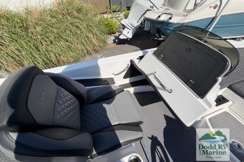 2021 Caymas CX 18 SS boat interior with cushioned seating and storage compartment.