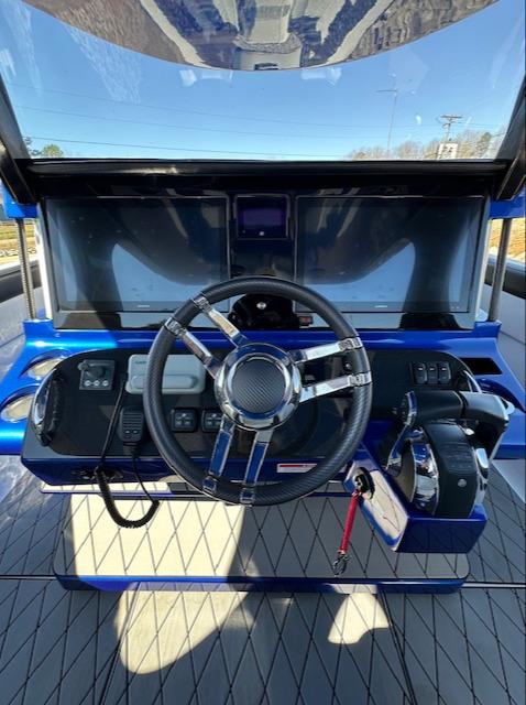 2019 Mystic Powerboats M4200 helm with modern controls and sleek steering wheel.