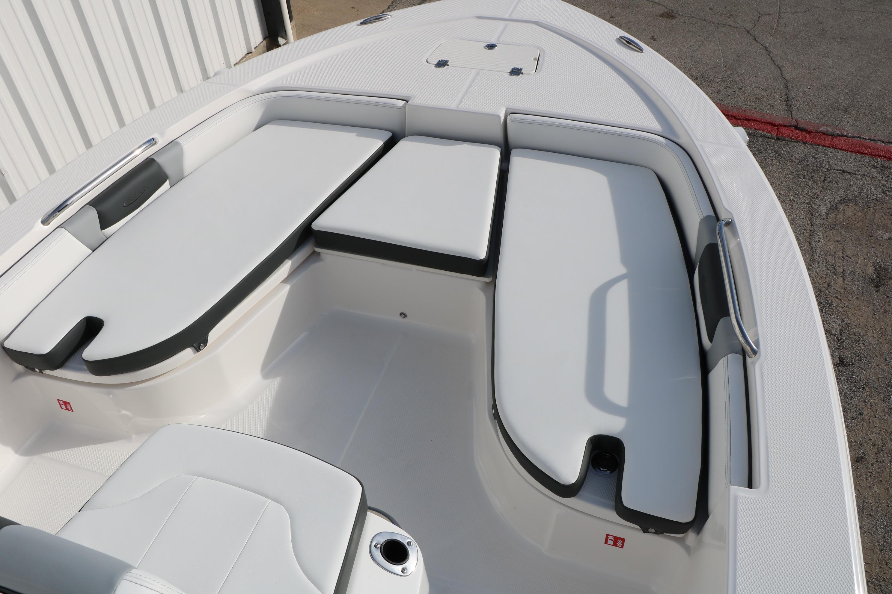 2026 Robalo 206 Cayman boat interior with white cushioned seating.