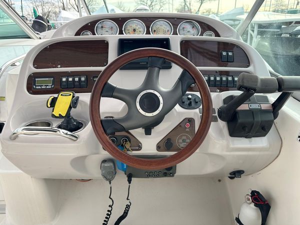 2006 Chaparral Signature 310 boat helm with wood steering wheel.