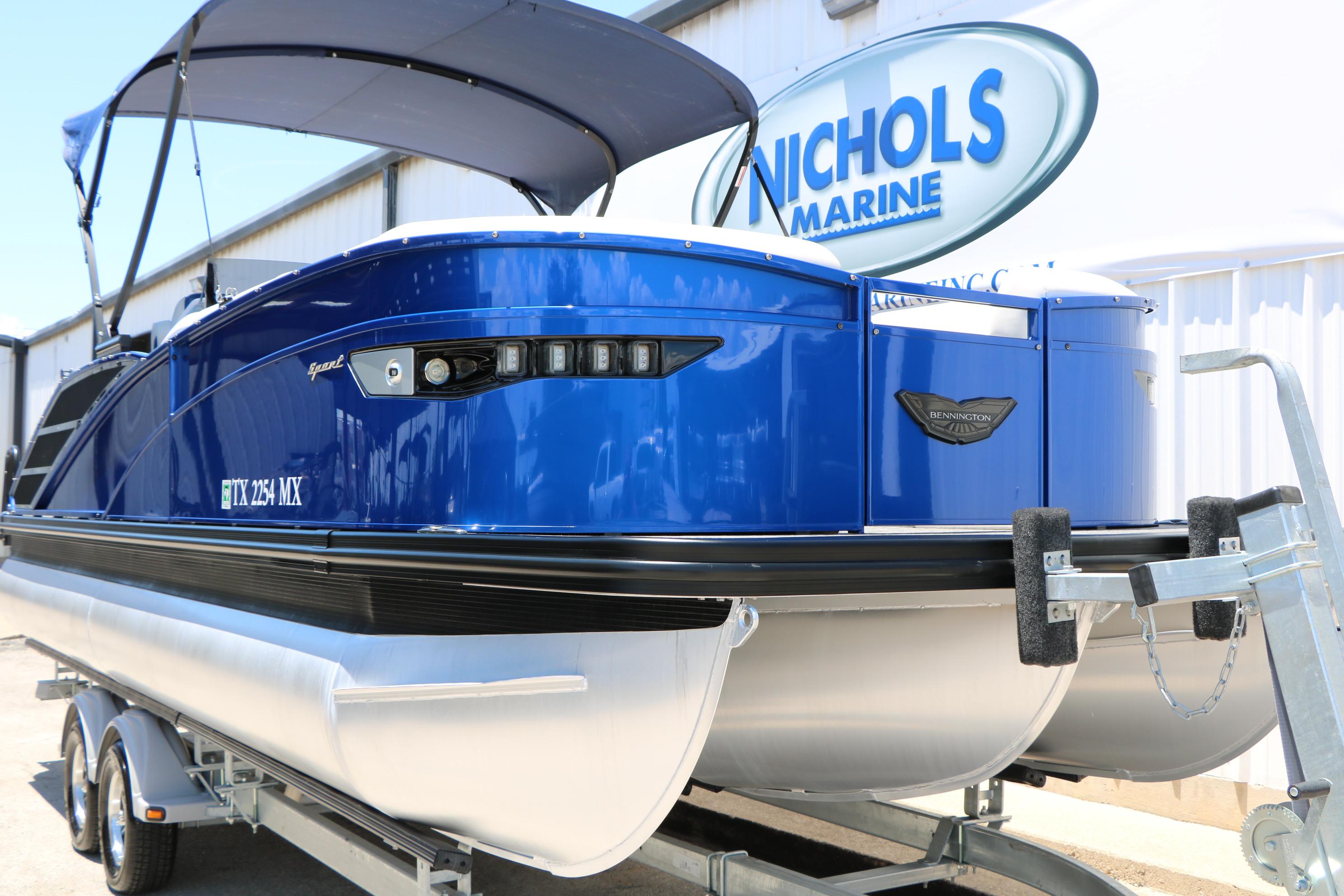 2024 Bennington 23 RX Swingback pontoon boat in vibrant blue at Nichols Marine.