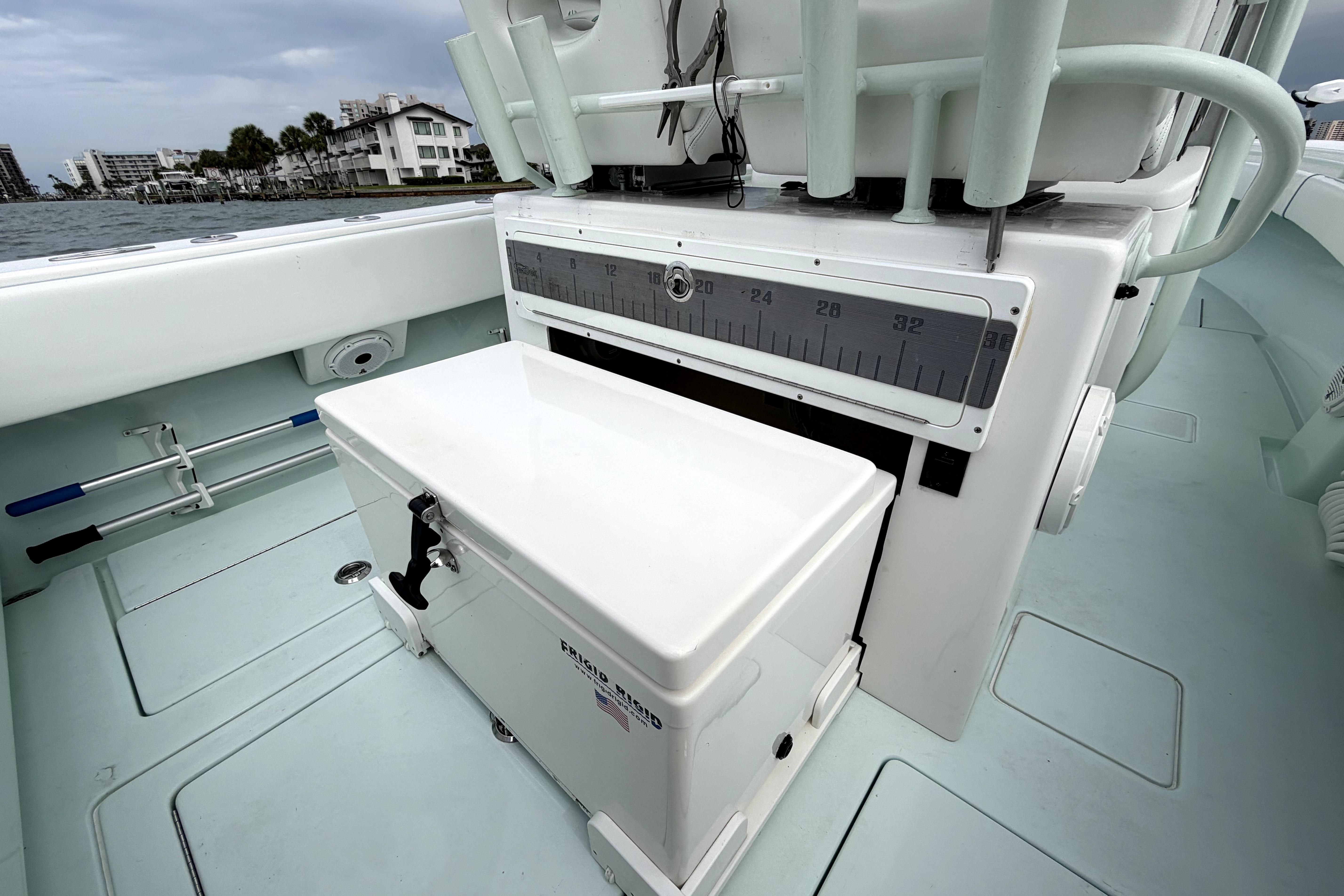 2019 Contender 30 ST boat interior with cooler and measuring scale, dockside view.