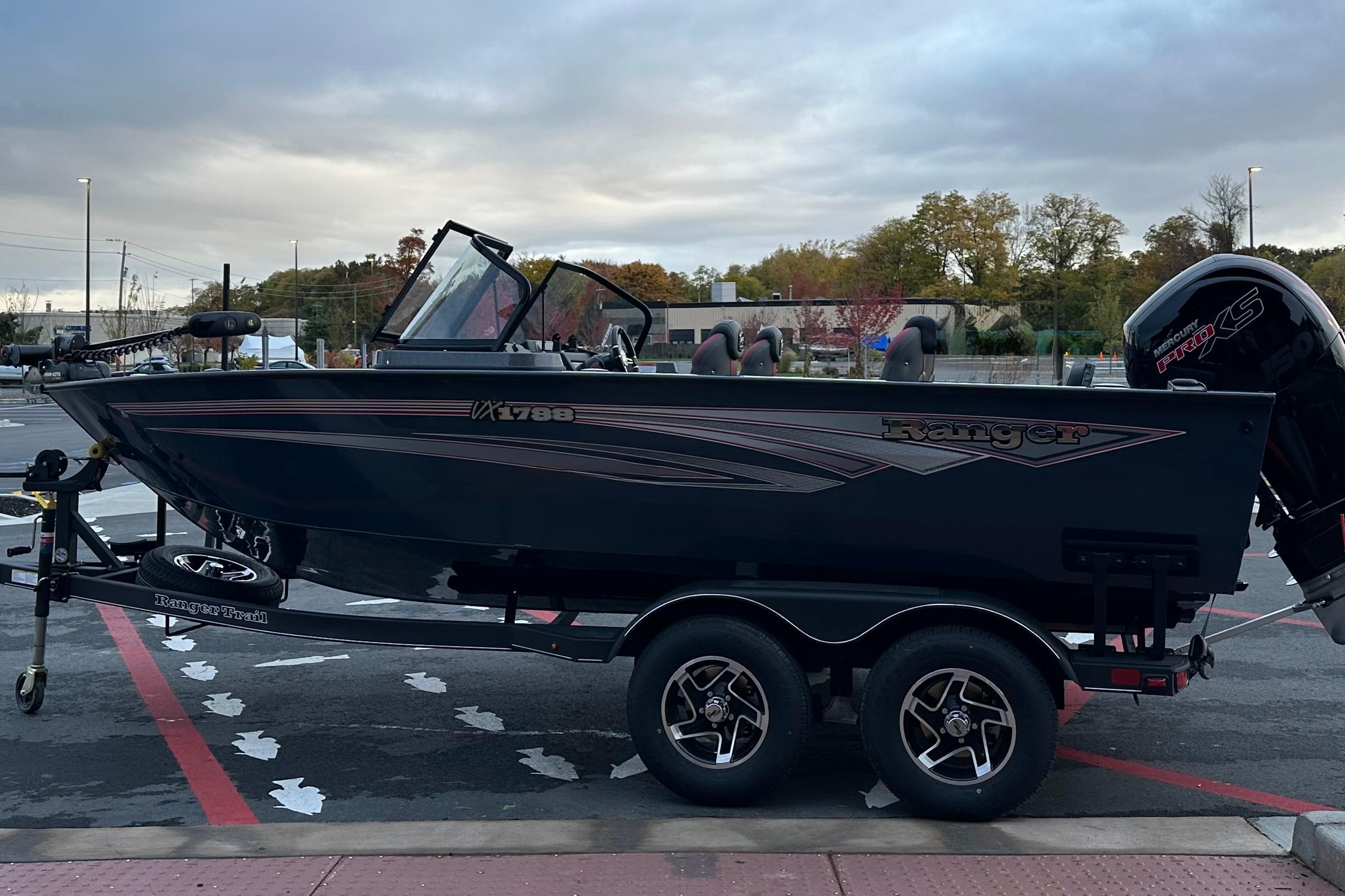 2026 Ranger VX1788 WT boat on trailer, parked outdoors under cloudy sky.