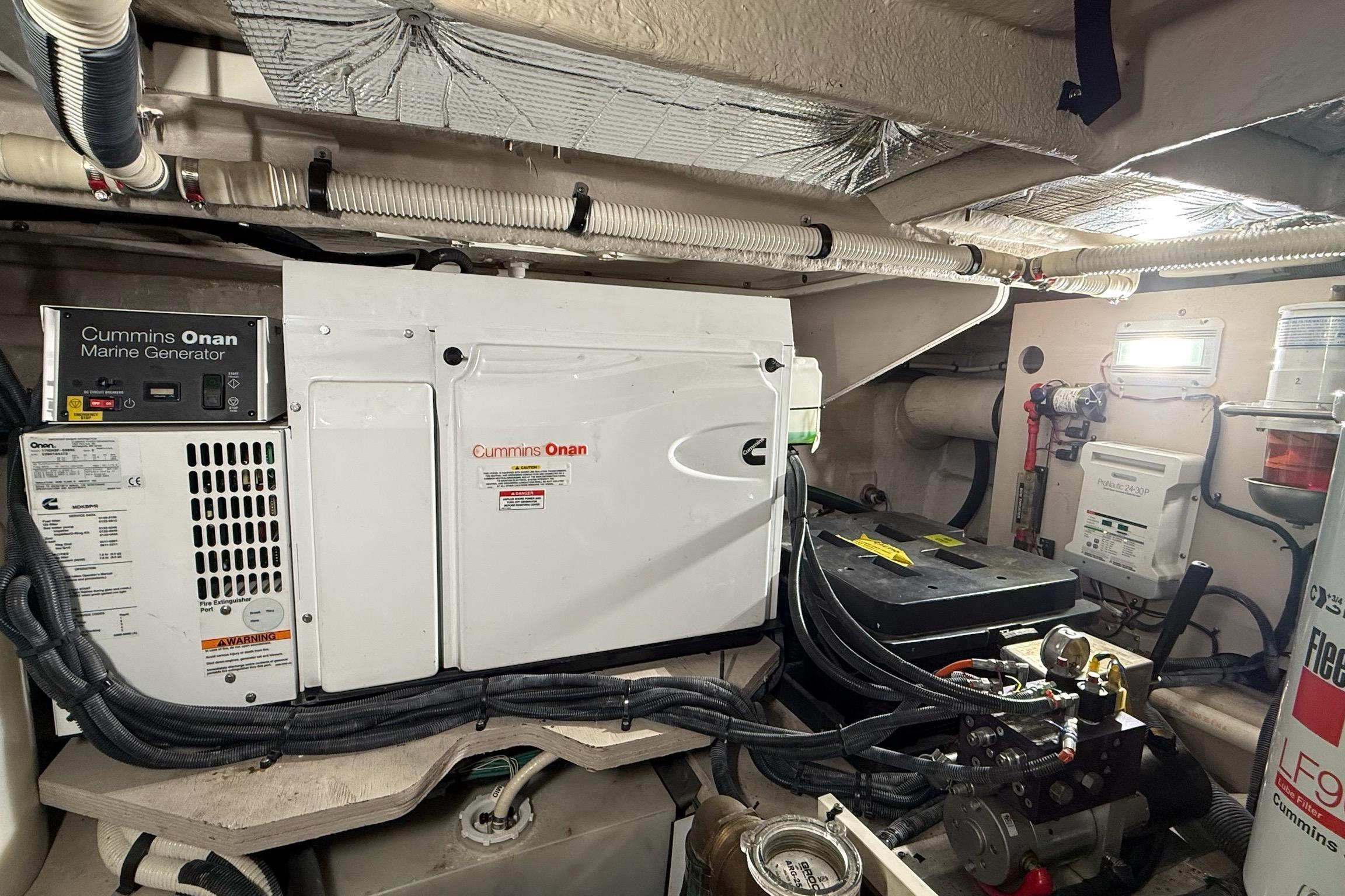 Engine room of 2009 Sea Ray 47 Sedan Bridge with Cummins Onan marine generator.