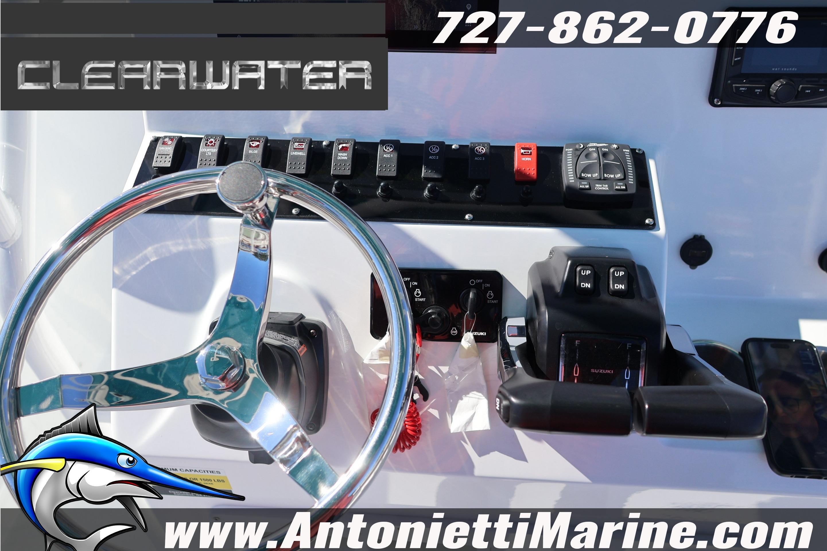 Clearwater 2300 boat dashboard with steering wheel and controls, 2026 model.