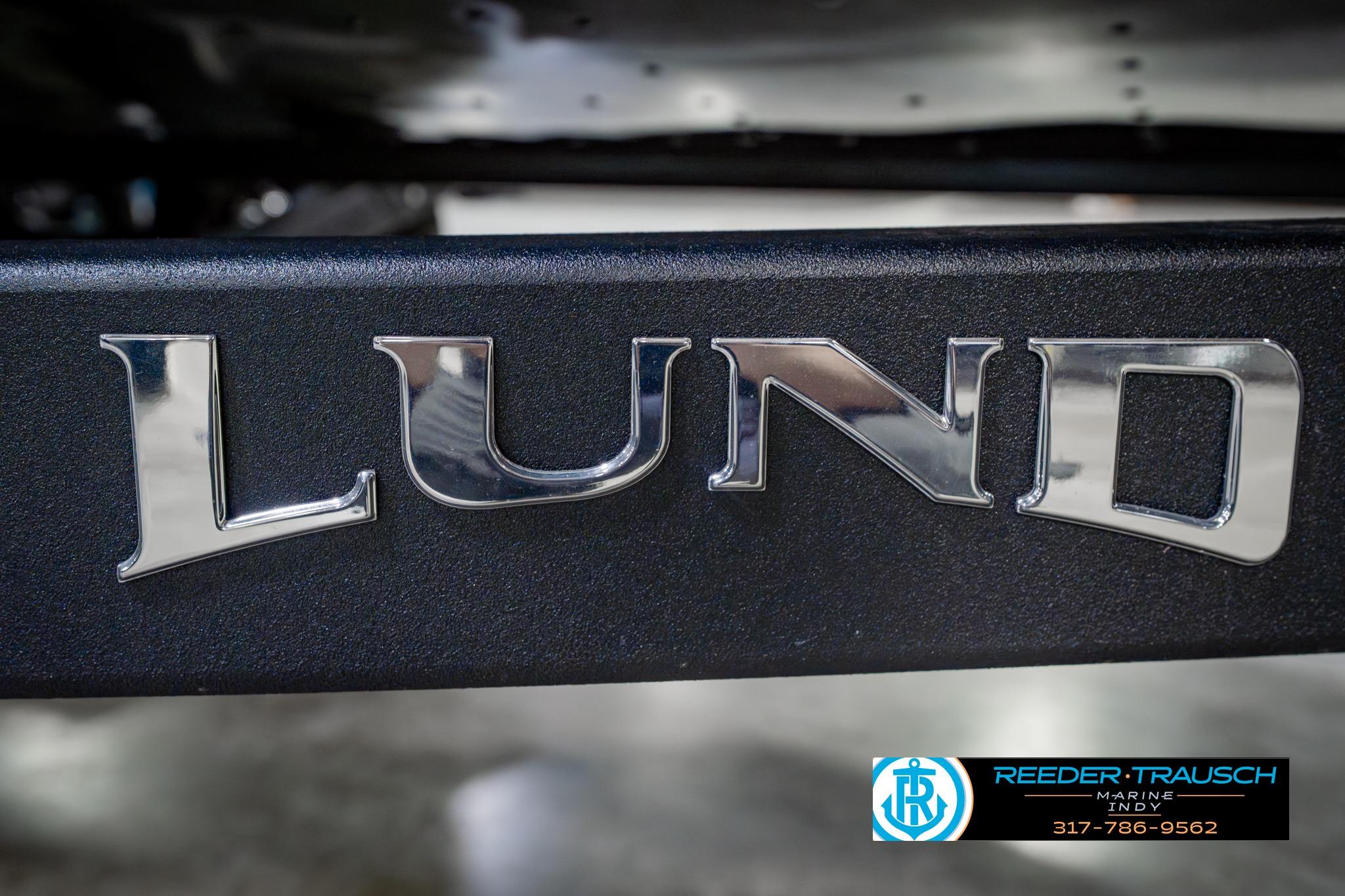 2026 Lund 1875 Impact XS boat logo with Reeder-Trausch Marine contact details.