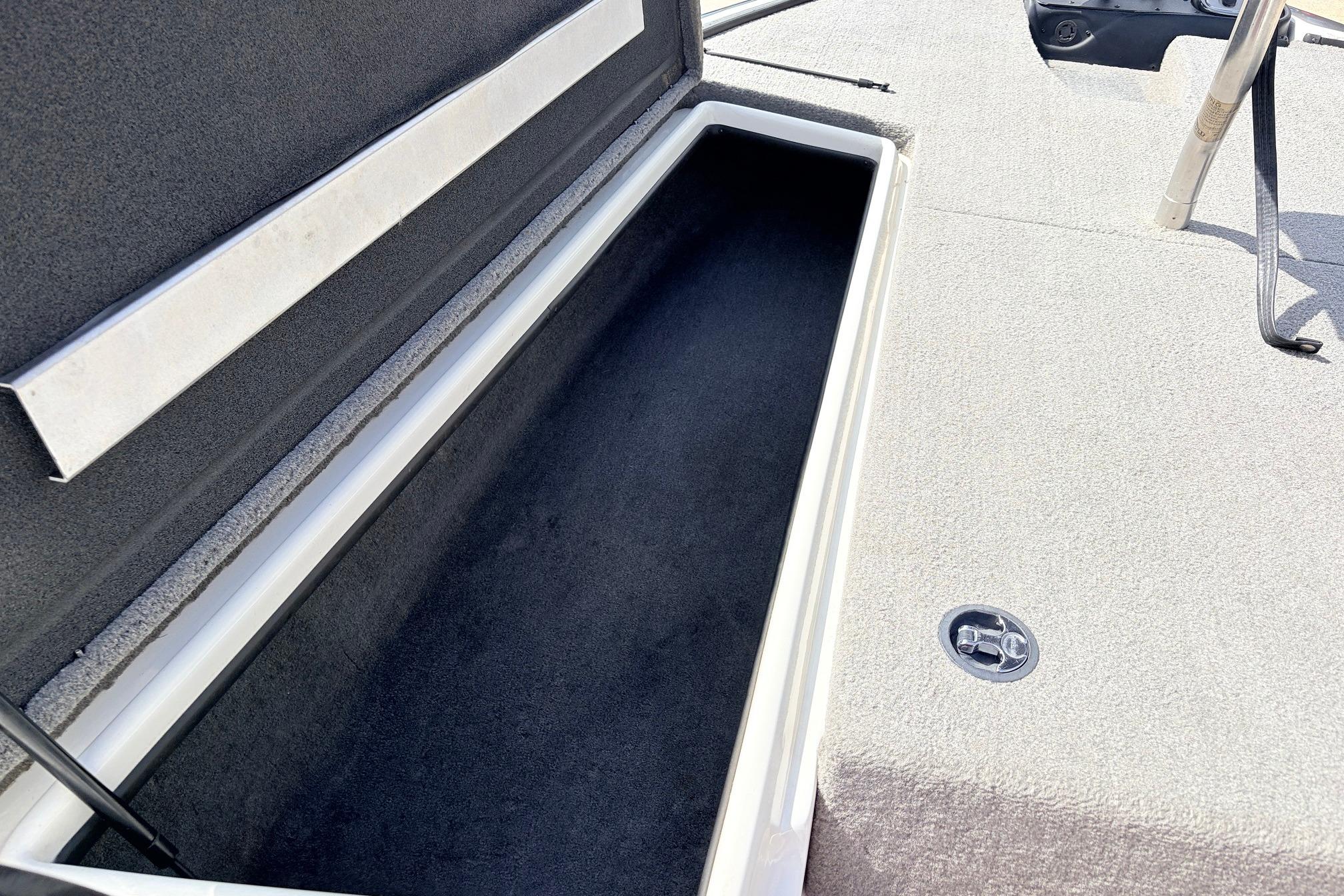 Open storage compartment on a 2011 Nitro Z-7 boat deck.