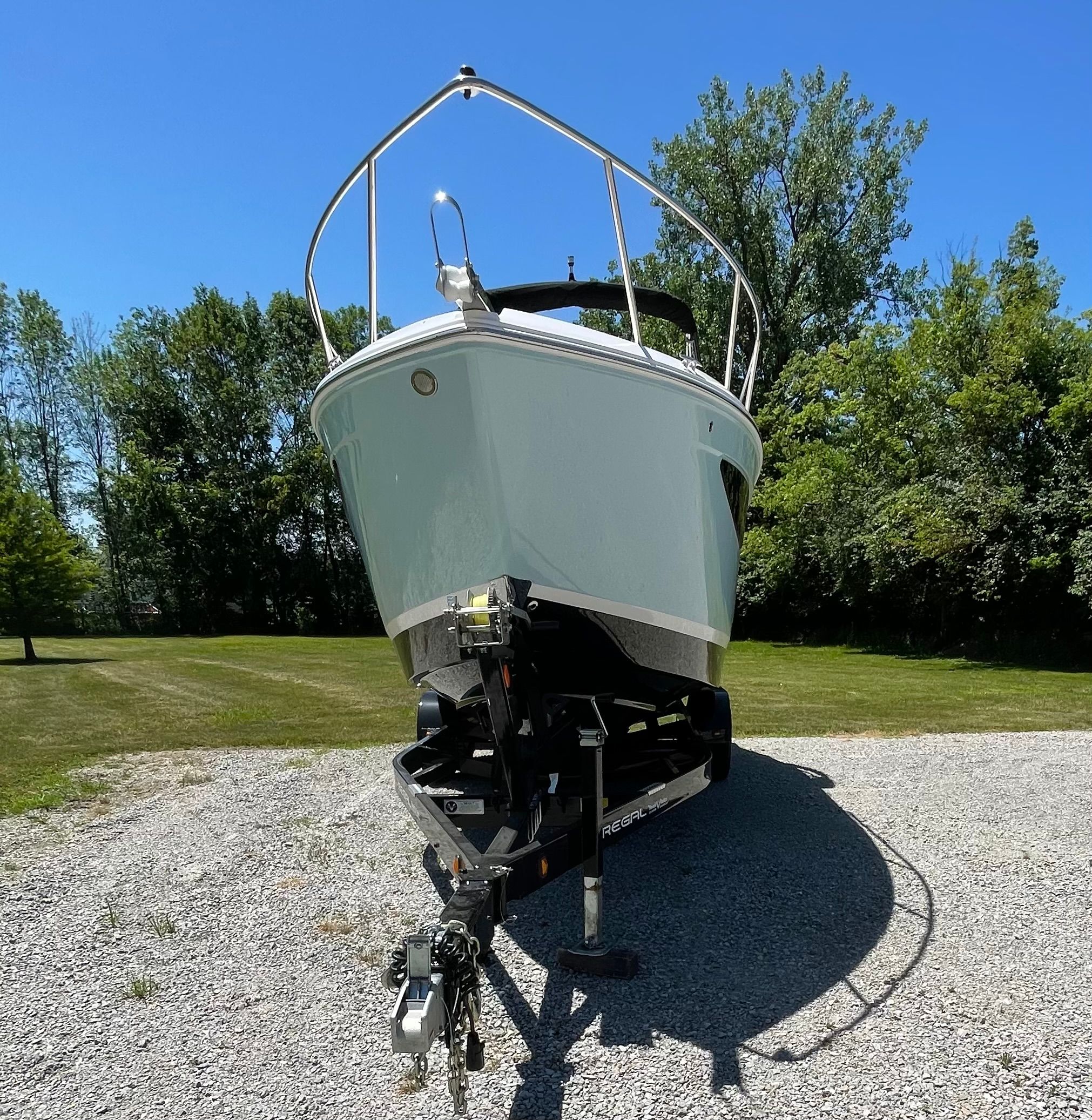 2022 Regal 26 Express boat on trailer outdoors.
